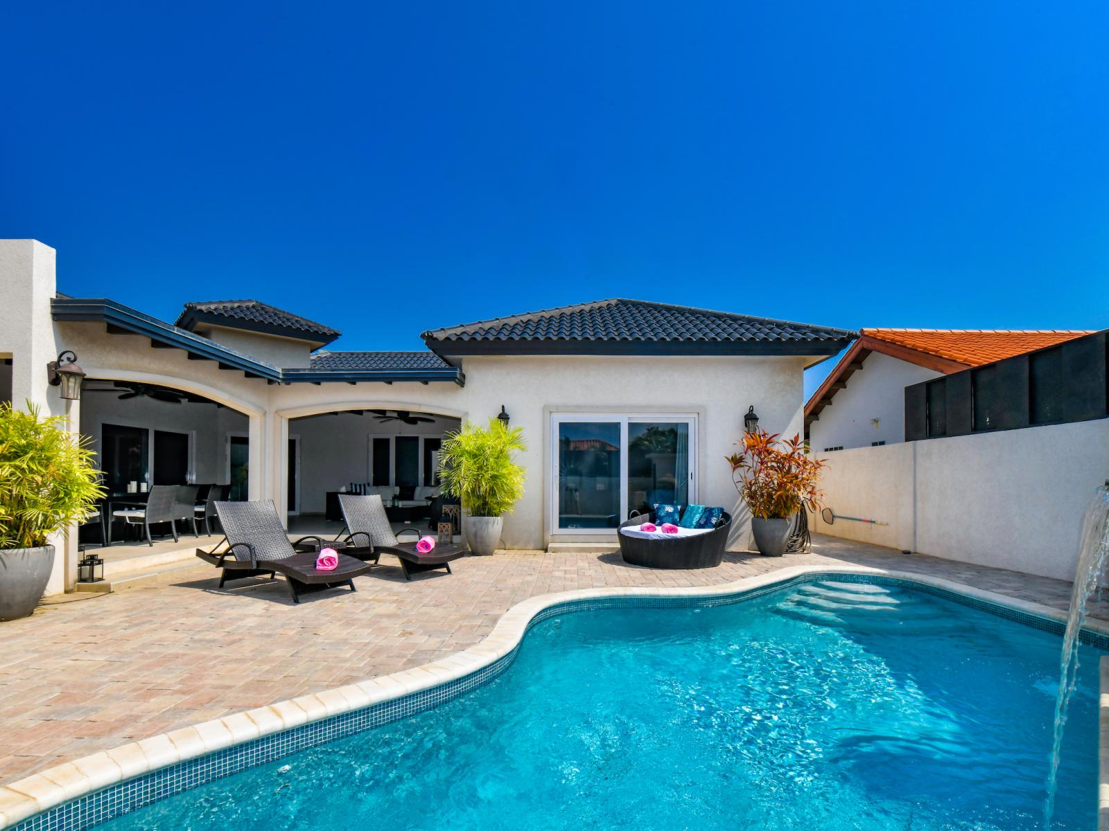 Amazing pool area of the villa in Noord, Aruba - Cosy beach chairs and neat and clean towels available - Beautiful mountain view - Superbly designed pool area - Refreshing Environment - Vibrant Atmosphere