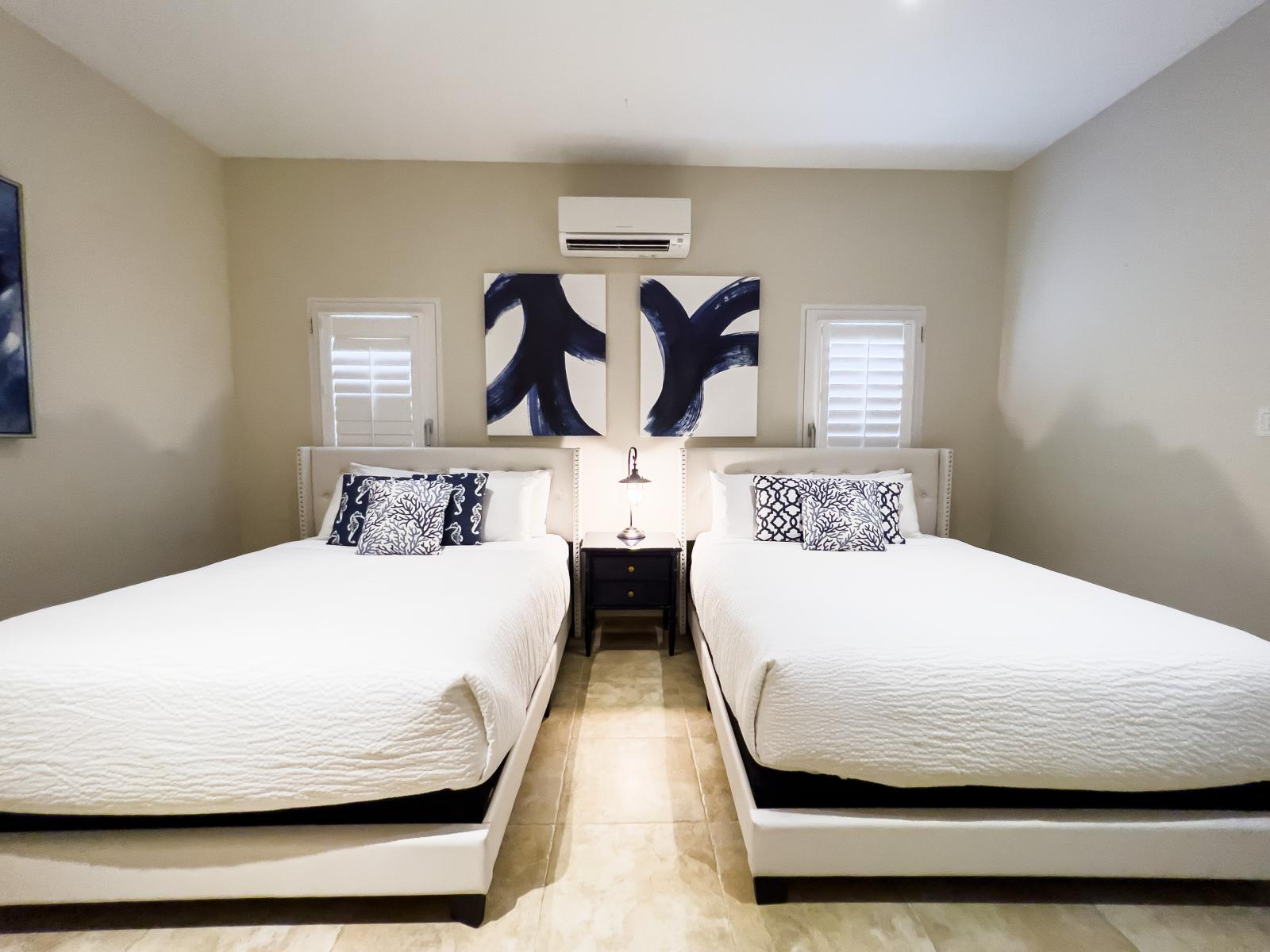 Escape to spacious serenity in Bedroom 2, where ample room invites you to unpack, unwind, and make yourself at home. Whether it's a weekend getaway or an extended stay, find comfort and relaxation in this inviting retreat.