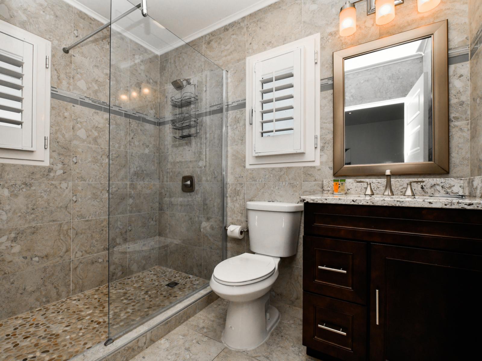 Refresh and rejuvenate in Bathroom 3's stylish walk-in shower. Combining sleek design with effortless functionality, it offers a luxurious and revitalizing experience.