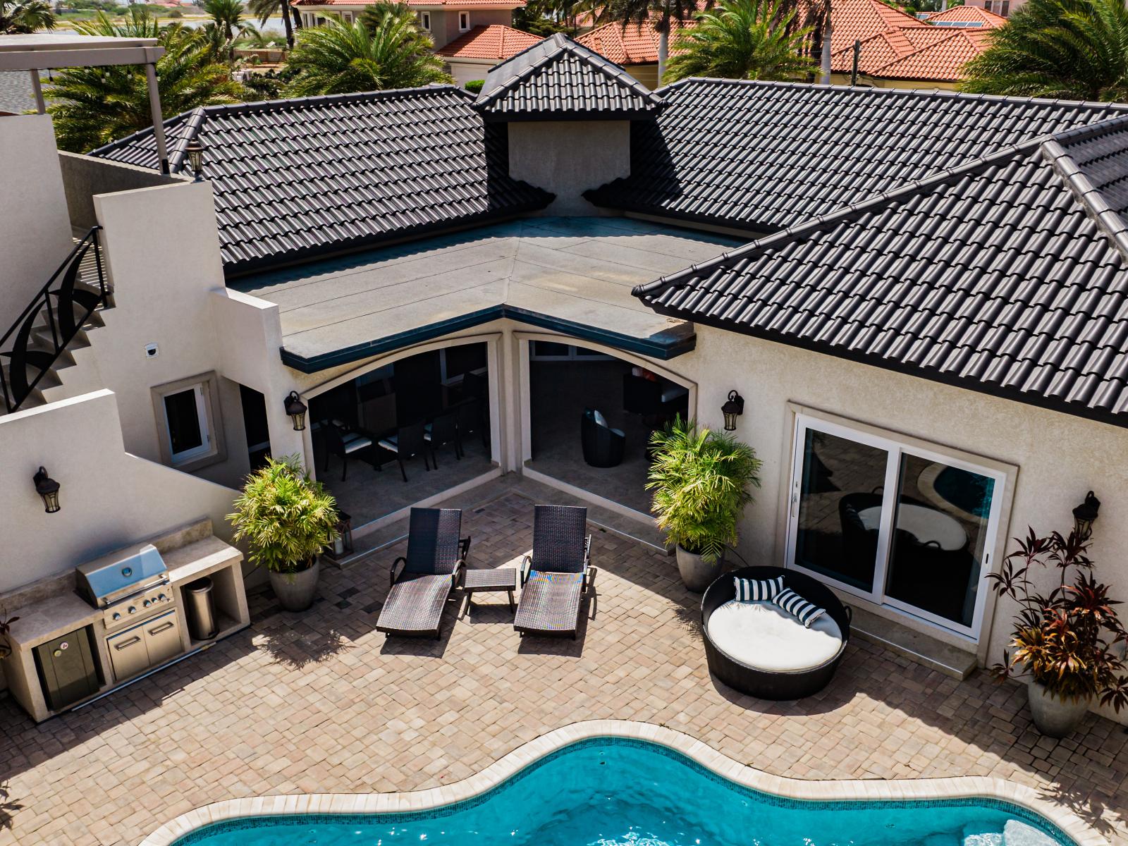 Elevate your expectations with a stunning aerial view of our home captured by drone. From this bird's eye perspective, witness the beauty and serenity of your future getaway, promising a stay like no other.