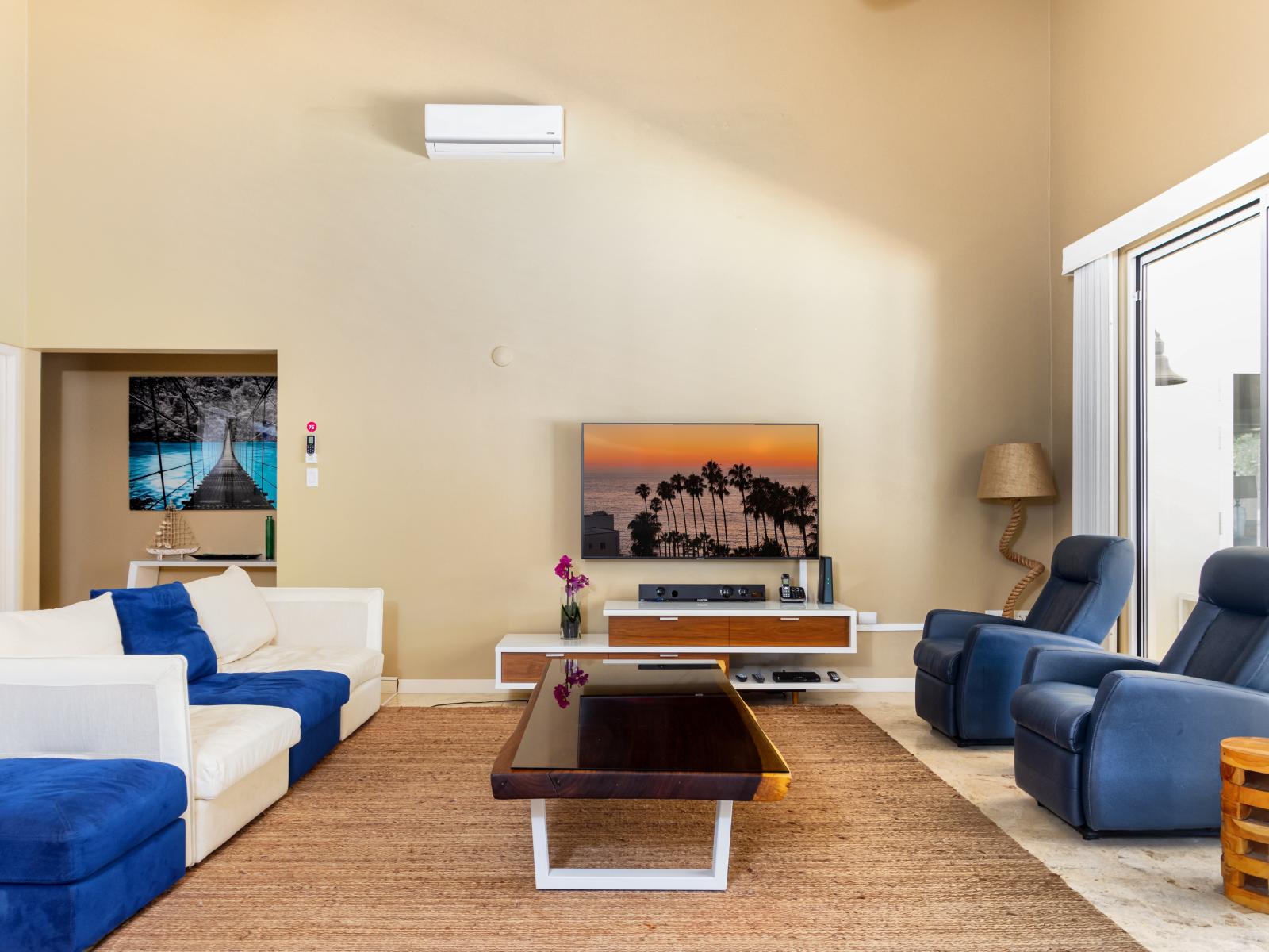 Cozy Living Area of the Villa in Noord Aruba - With high ceilings creating sense of Spaciousness - Smart TV and Netflix - Stylish furniture arrangement providing comfort and a cohesive look