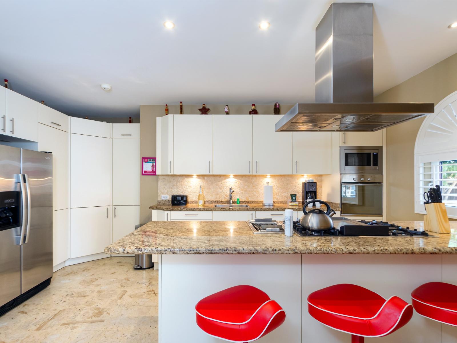 Modern Kitchen of the Villa in Noord Aruba - Well-lit space with strategically placed task lighting - Elegant and coordinated color palette for a cohesive look - Fully Equipped