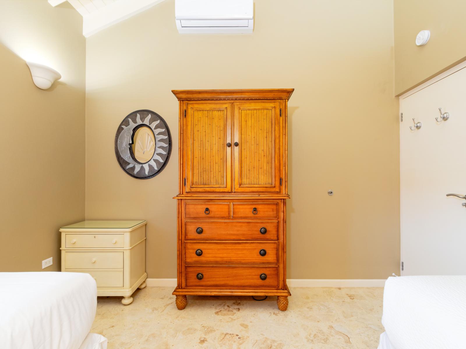 Fanciful Bedroom of the Villa in Noord Aruba - Cozy retreat with a plush bed, perfect for relaxation - Smart use of space with efficient storage solutions - Luxurious bedding for a restful night's sleep