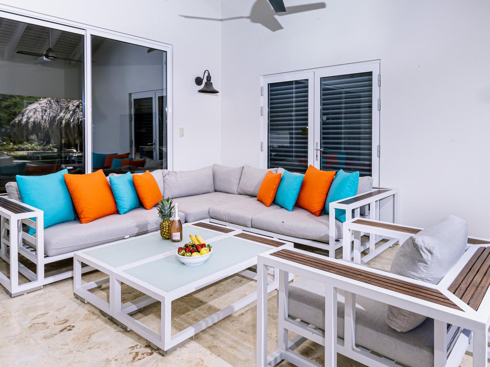 Plush Outdoor seating area of the Villa in Noord Aruba - Plush seating arrangements invite relaxation and stylish gatherings - Refreshing Atmosphere