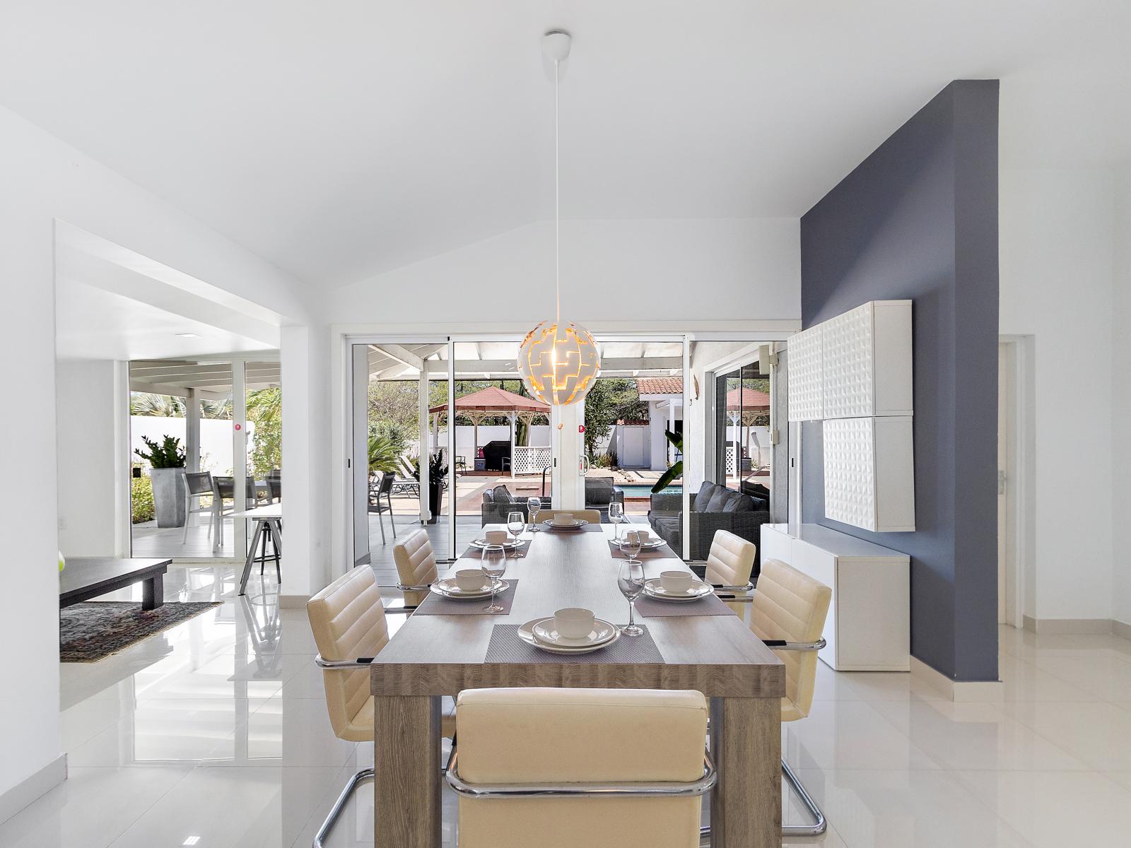 Dining area with access to the backyard with glass sliding doors