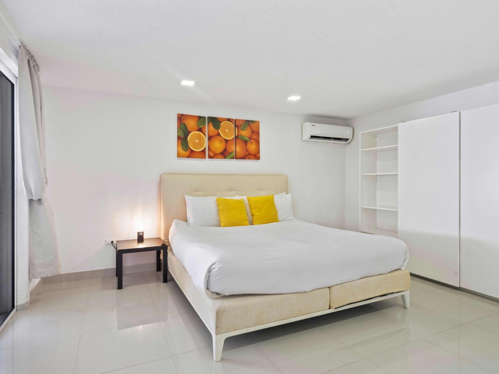 Experience luxury in Main Bedroom 1 with its king bed and smart TV, designed for a relaxing and enjoyable stay.