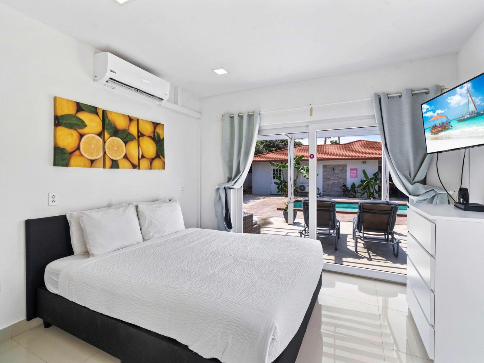 Relax in Bedroom 3, a distinct apartment with a Queen bed, offering both comfort and separation from the main living areas.