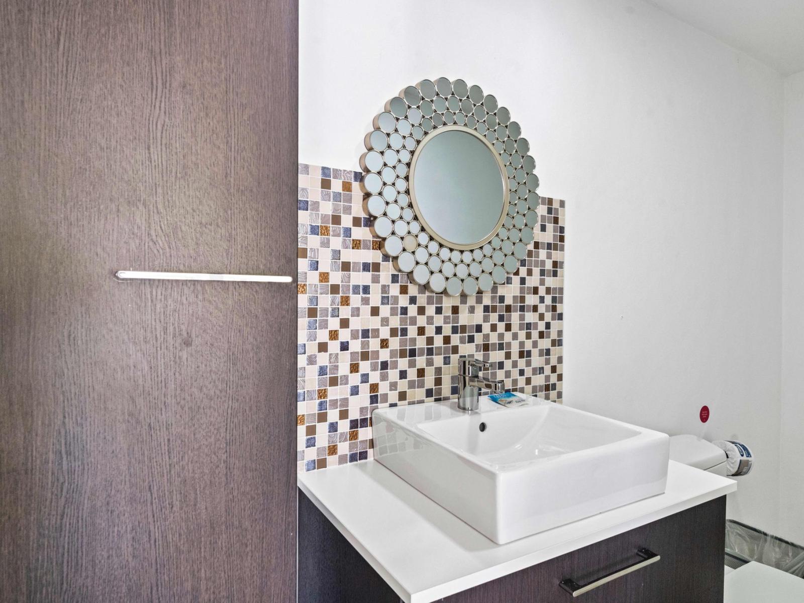 Our cozy half bathroom offers a stylish and convenient space for your needs.