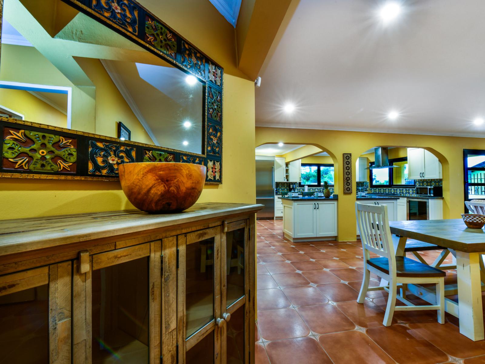 Radiant dining and kitchen Area of the 4BR House in Noord Aruba - Meal Bar near Kitchen for easy Access - Open layout seamlessly connecting the dining area to the kitchen and living room - Stylish, contemporary furnishings enhancing the aesthetic