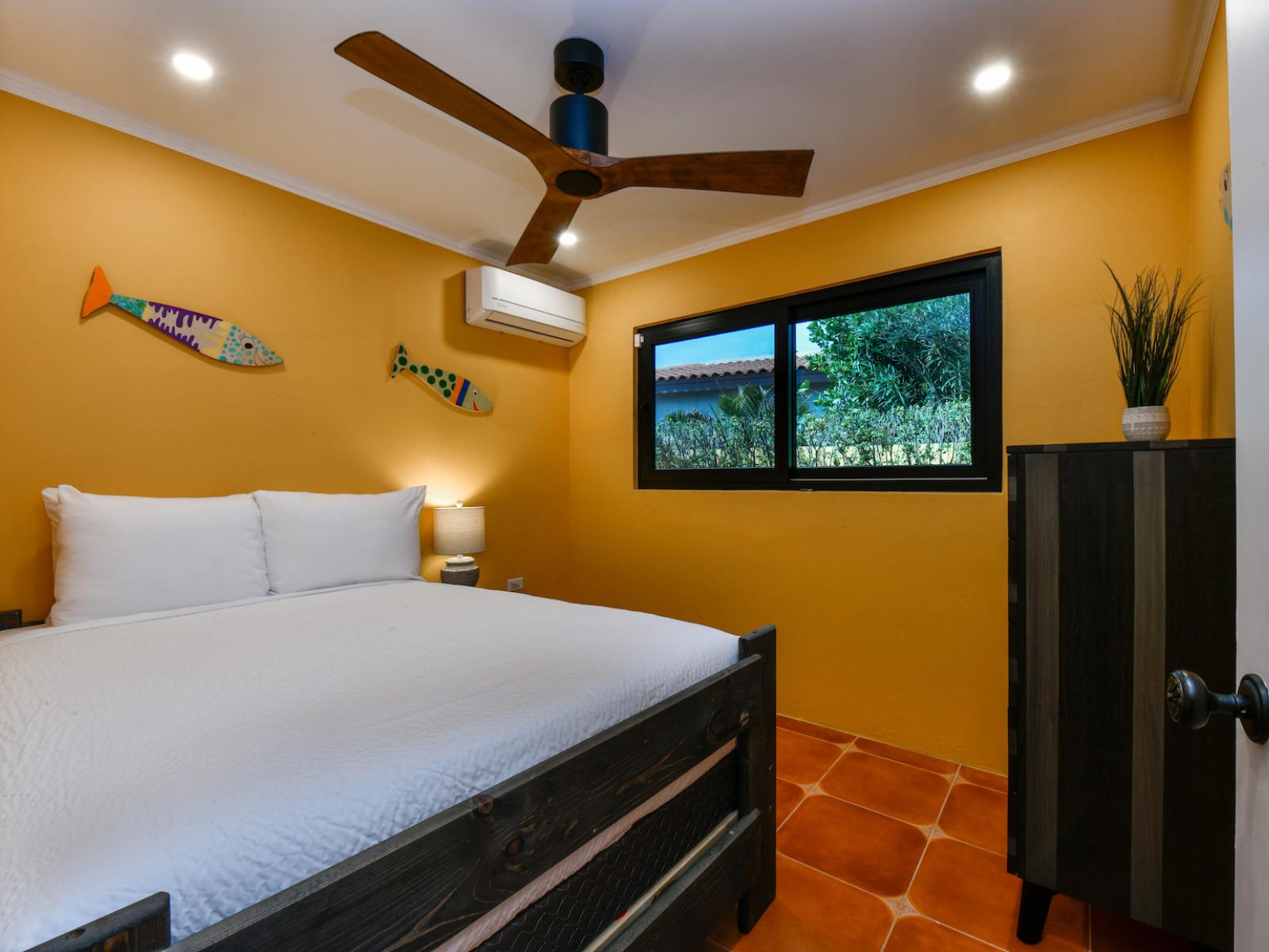 Relax in our second bedroom, featuring a king bed, smart TV, and private en-suite bathroom.