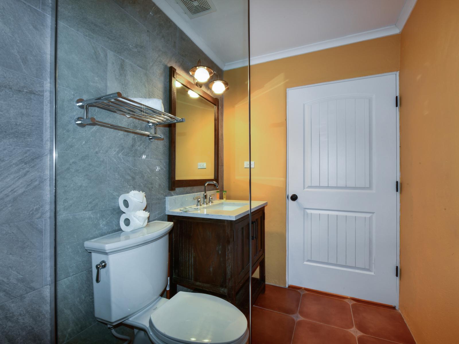 Step into luxury in the second bedroom's bathroom, boasting a contemporary walk-in shower.