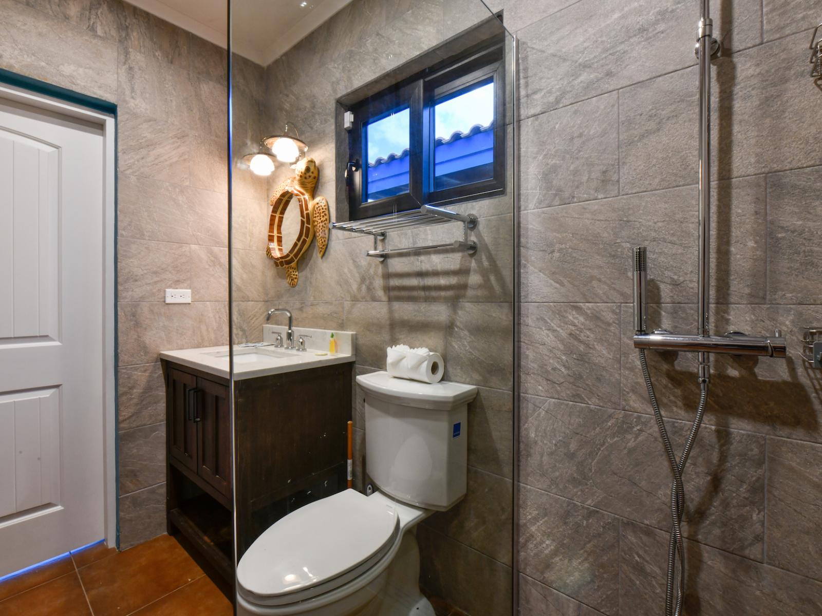 The third bedroom's en-suite bathroom offers a serene escape with its elegant walk-in shower.