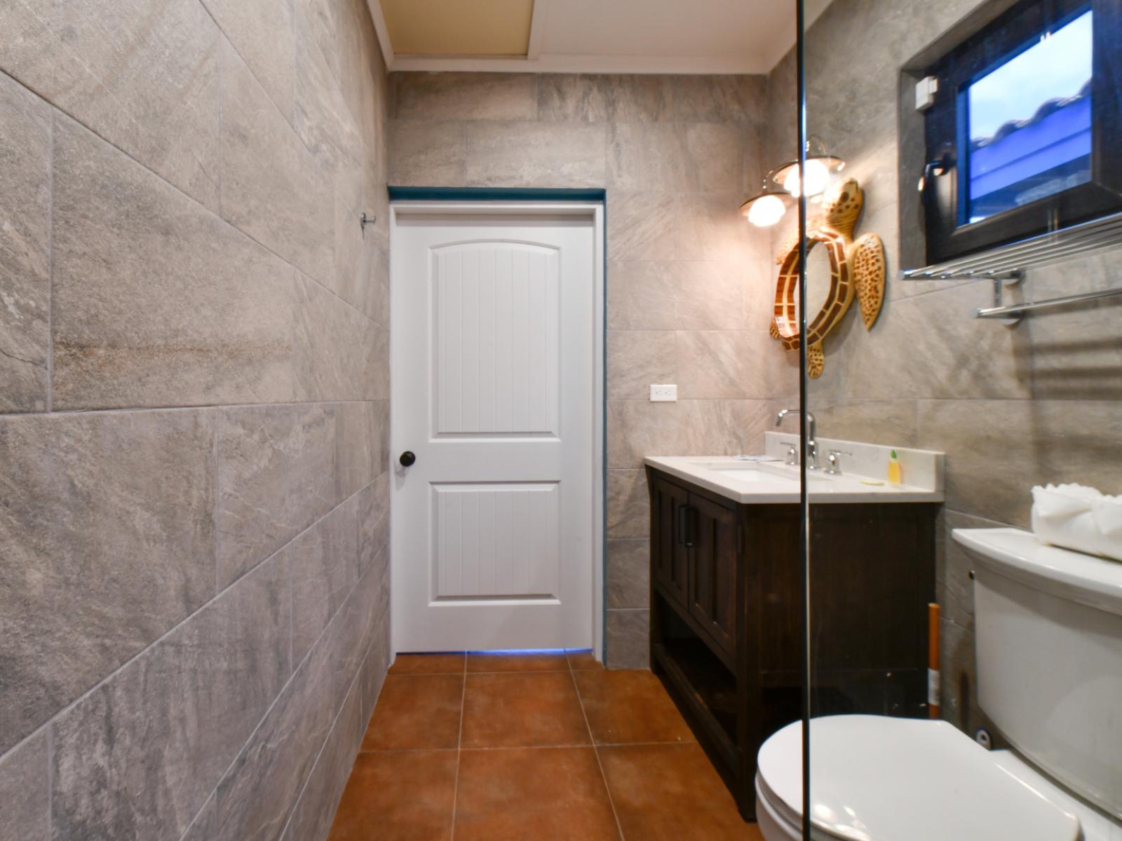 Enjoy the convenience of the walk-in shower in the third bedroom's stylish en-suite bathroom.