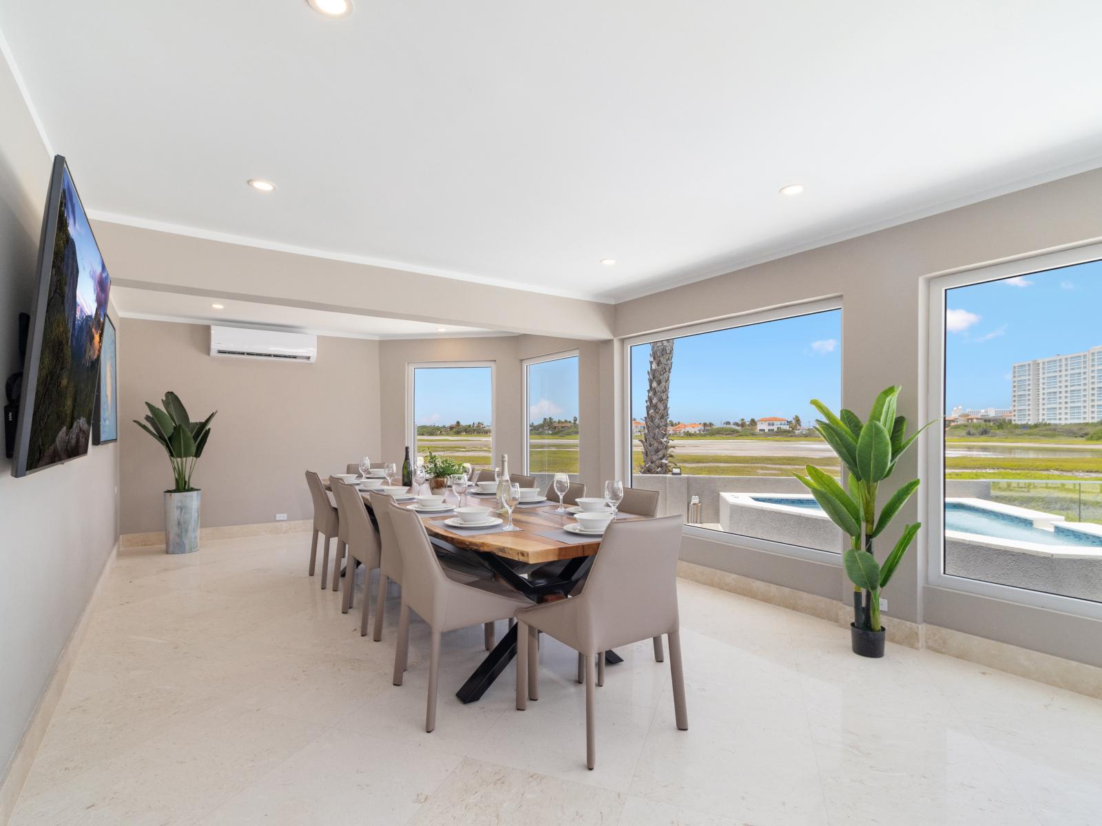 Grand Dining Area of the Villa in Noord Aruba  - 12 Persons dining - Stunning outside views - Smart TV and Netflix - Experience breathtaking views via windows, welcoming natural light