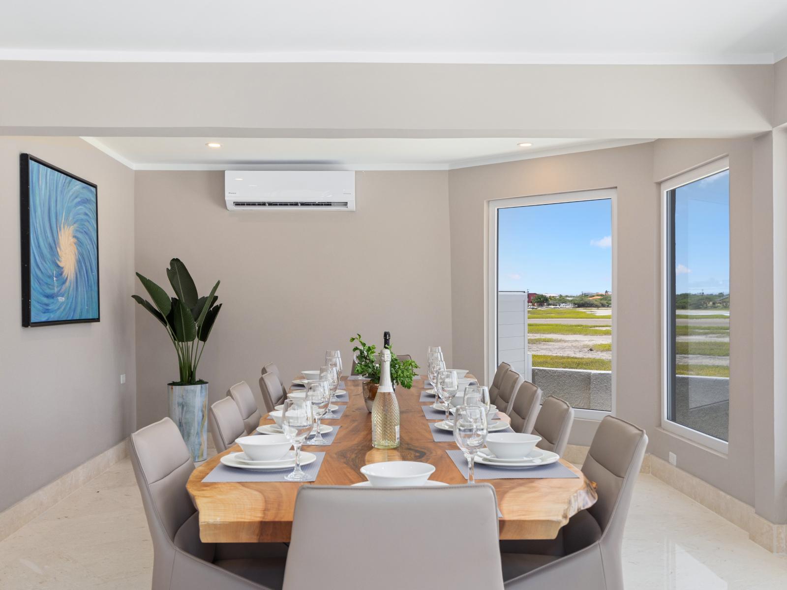 Lush Dining Area of the Villa in Noord Aruba - Dining for 12 Persons - Smart TV and Netflix - Chic dining area featuring a stylish table and contemporary seating - Harmonious color scheme for a cohesive and stylish look