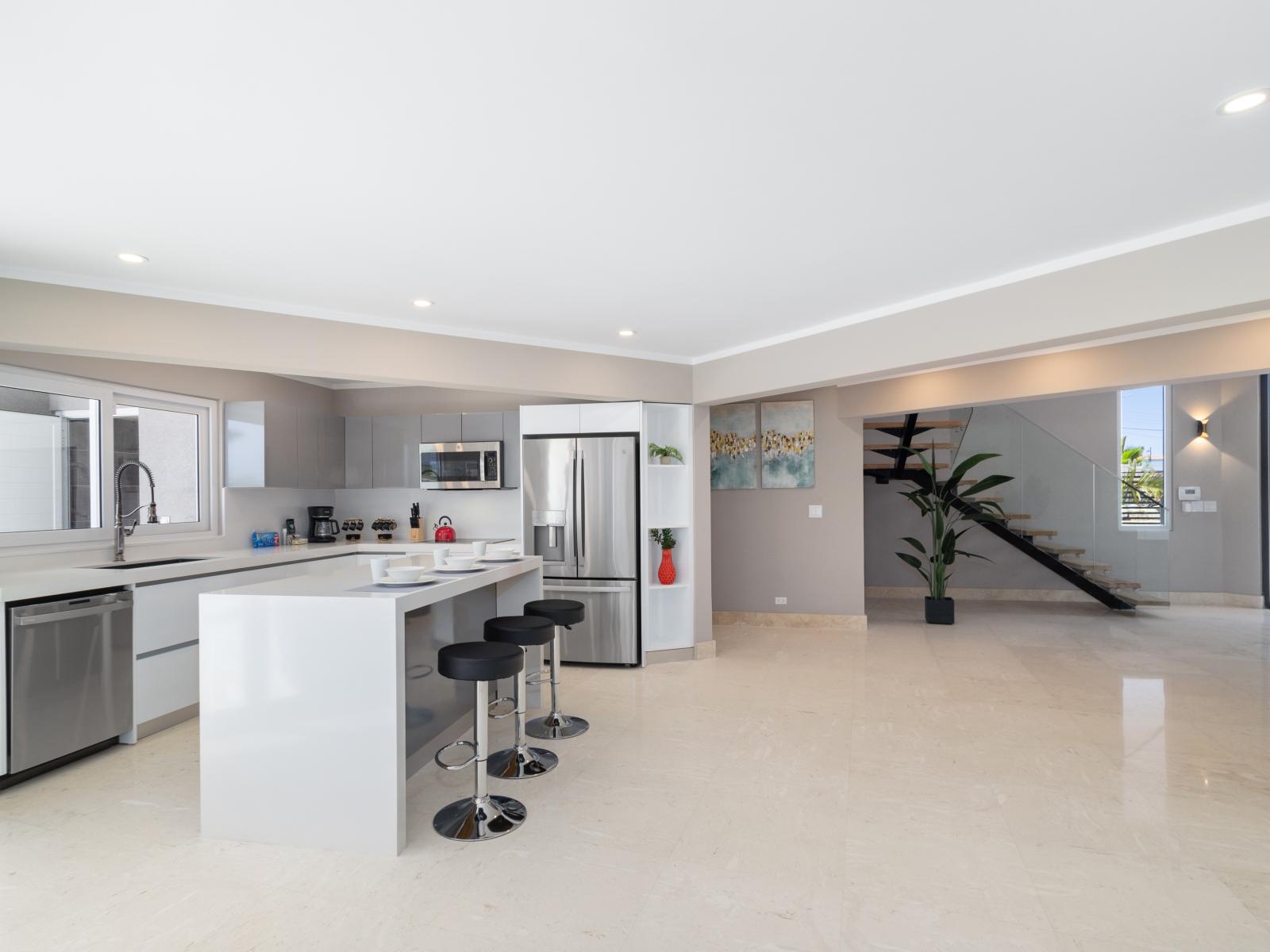 Chic Kitchen Area of the Villa in Noord Aruba - Integrated appliances for a seamless and stylish appearance - Fully Equipped - Open concept connecting the kitchen to the living area