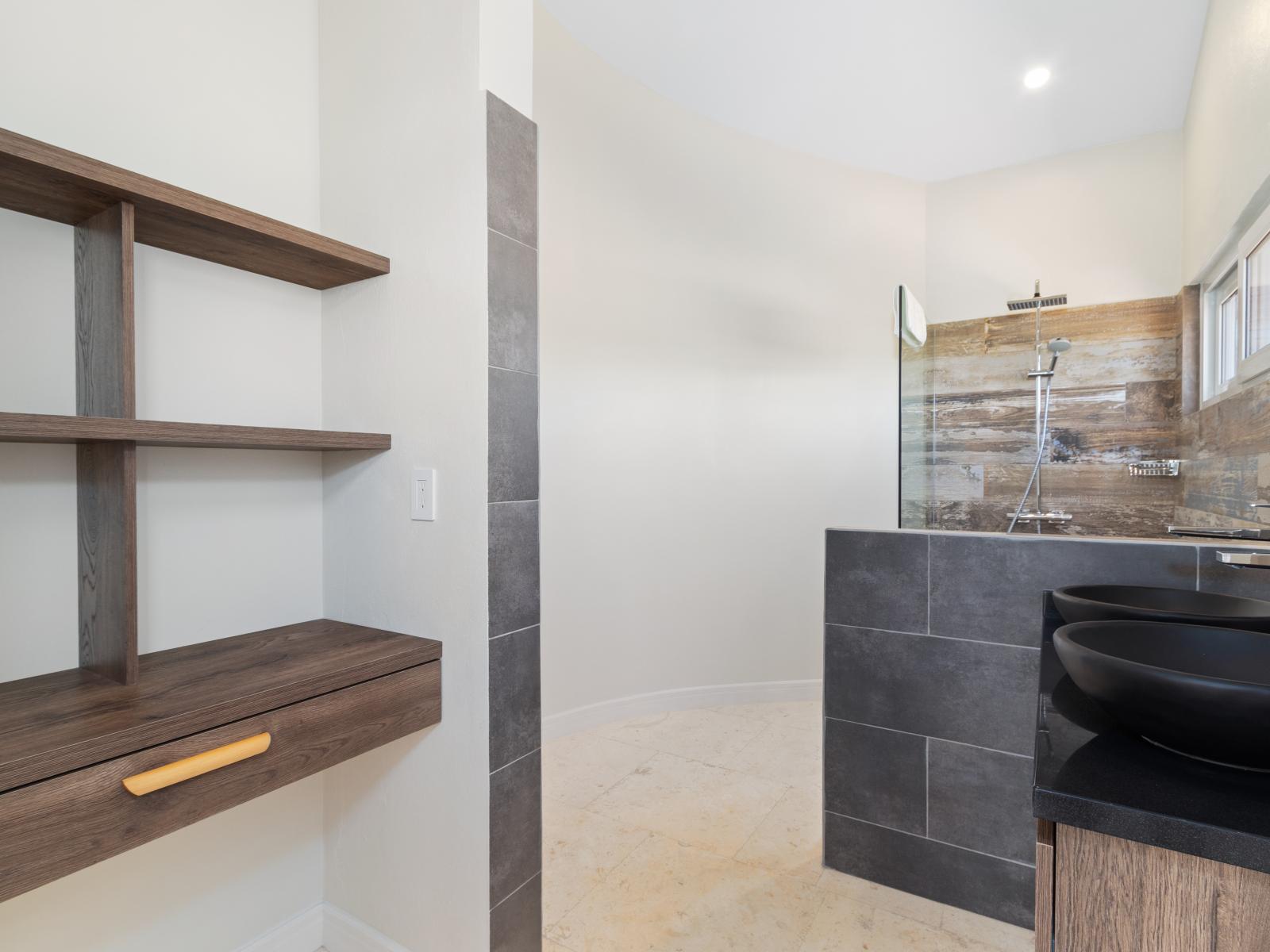 Polished Bathroom of the Villa in Noord Aruba - Walk in shower - Chic Dual Vanity - Thoughtful storage solutions with stylish Drawer and shelves