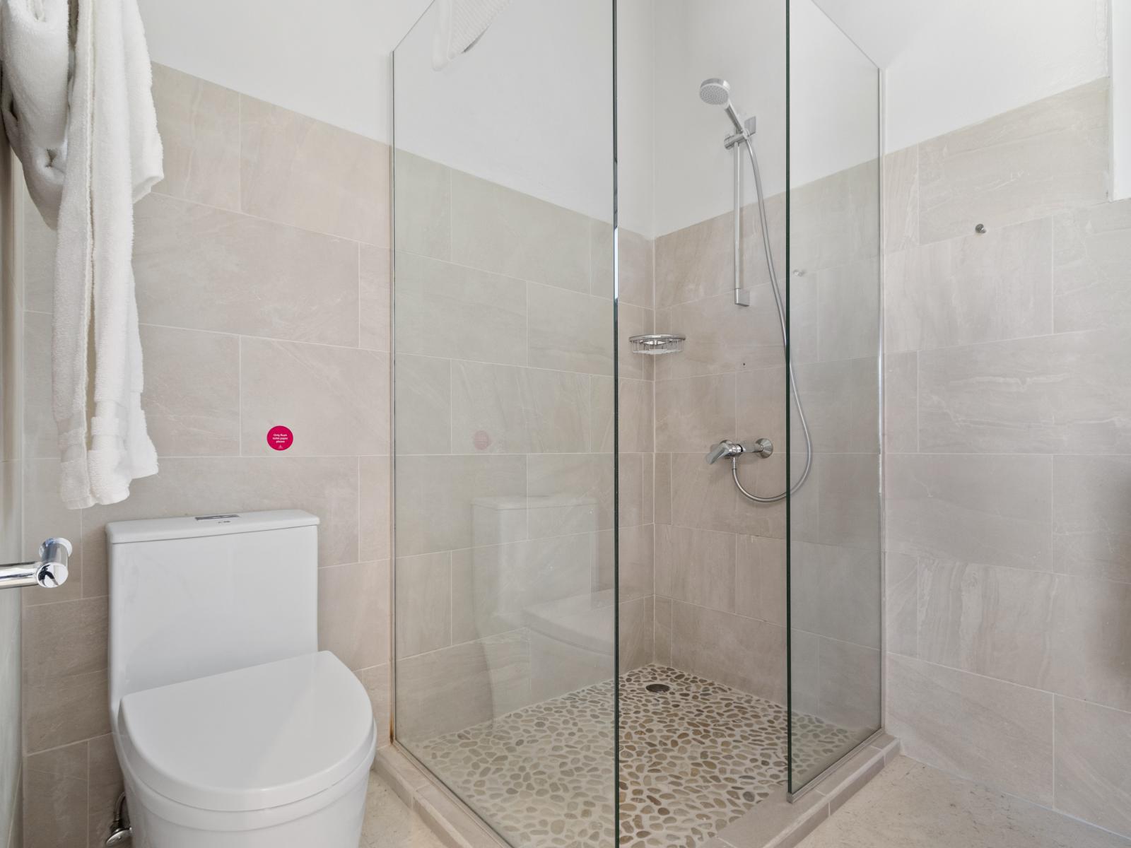 Refresh and rejuvenate in Bathroom 4, featuring a spacious walk-in shower for a relaxing and invigorating bathing experience.