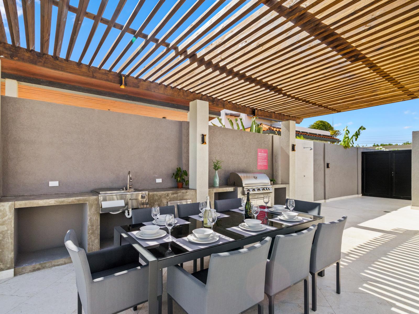 Elevate your dining experience with our outdoor kitchen and dining area, where culinary delights meet al fresco ambiance for memorable gatherings under the open sky.