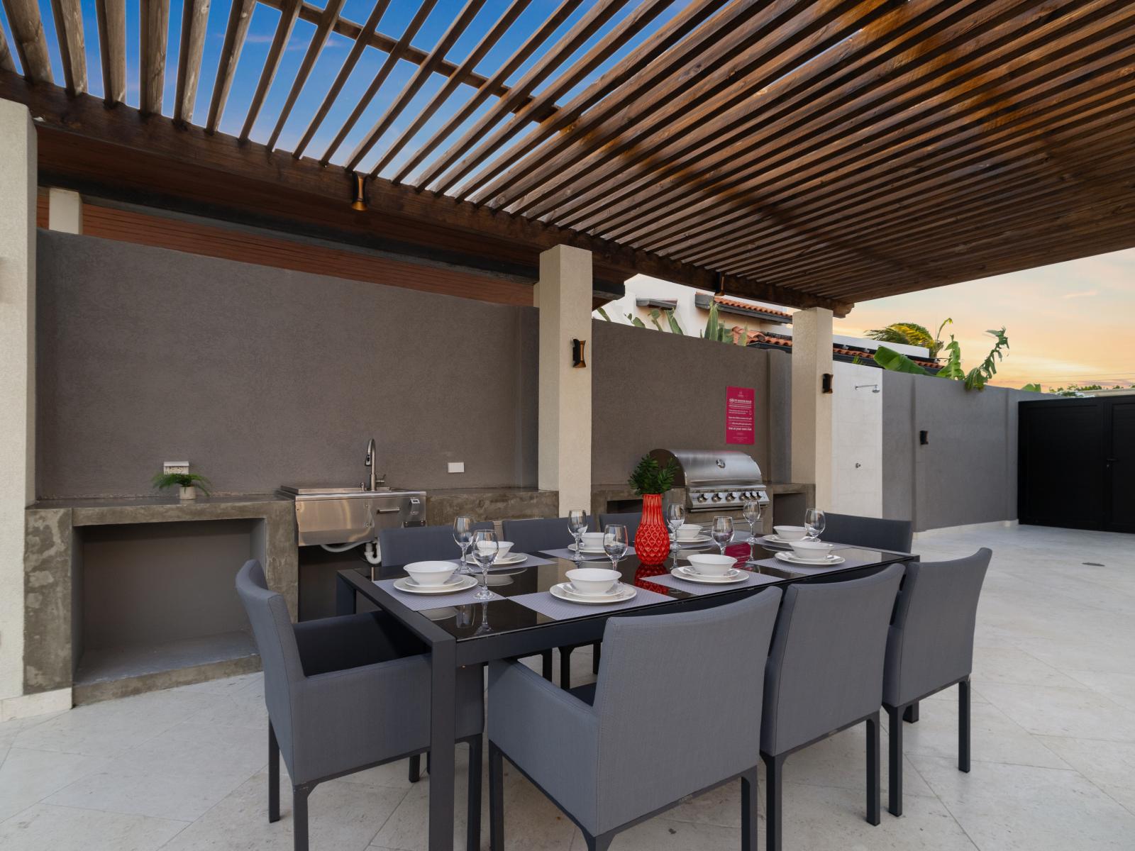 Sunset Dining Delight: Gather with loved ones around our spacious outdoor dining table, ideal for enjoying picturesque sunset dinners with seating for eight.