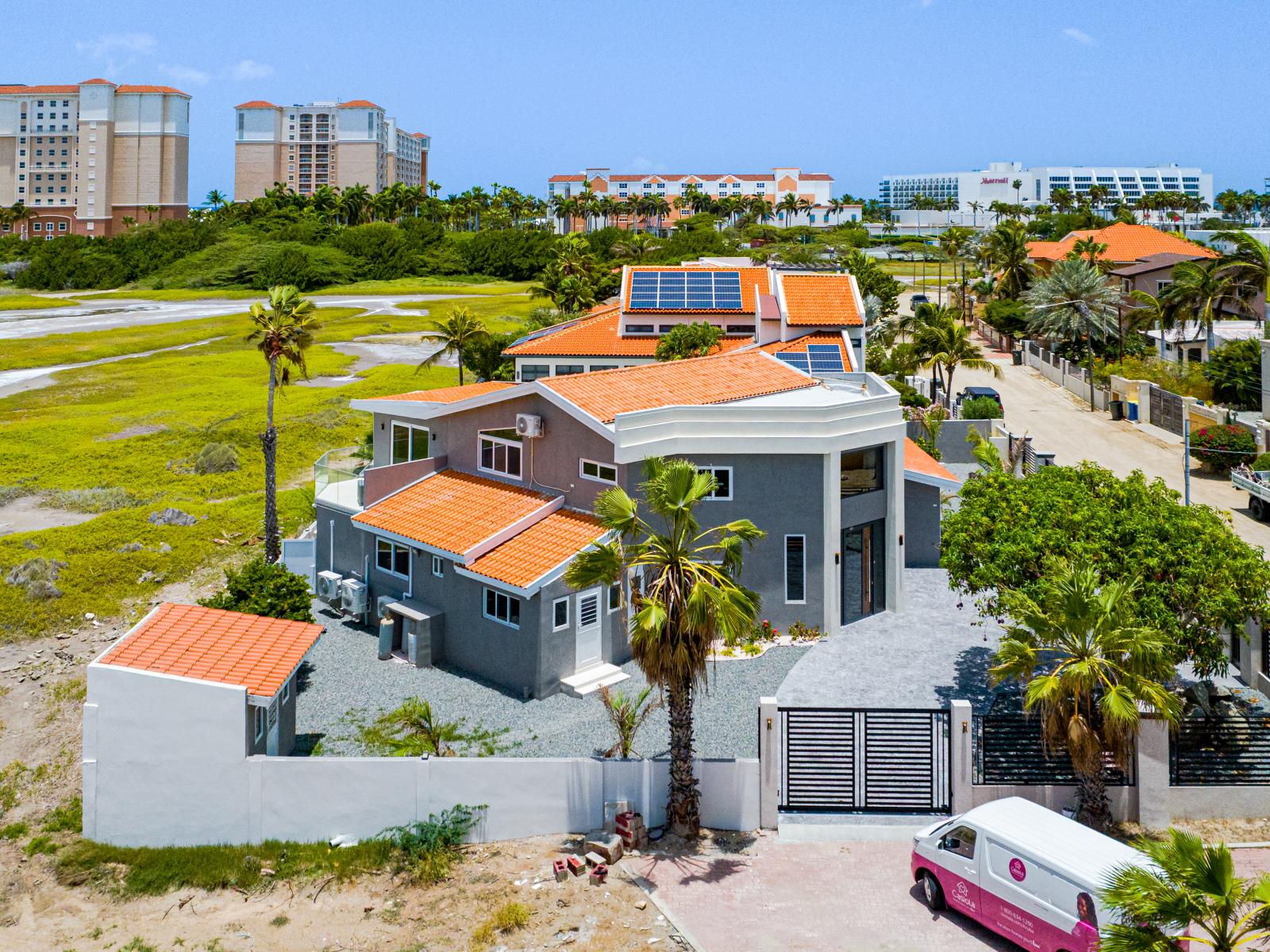 Aerial side of home with  Marriott hotels in background 