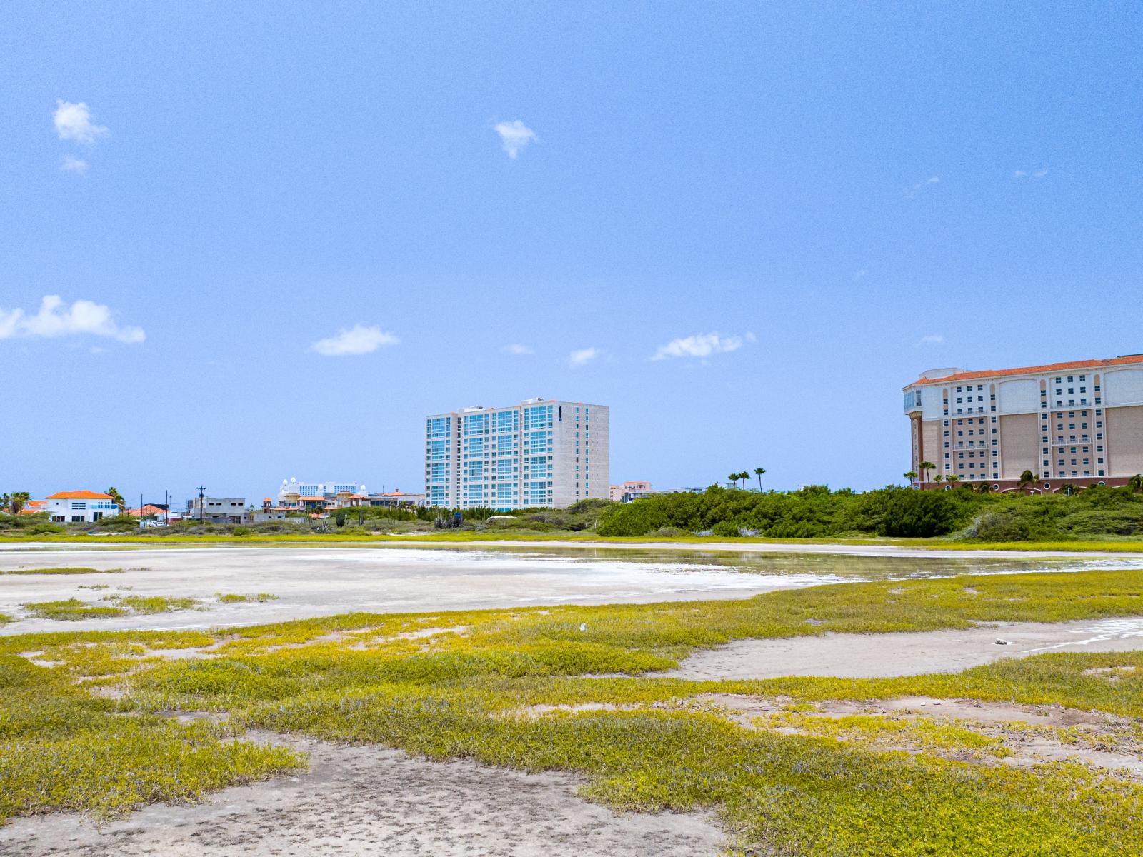 Scenic Saliña Vista: From our home, enjoy a captivating view that seamlessly blends the tranquil beauty of the saliña with the grandeur of the high-rise area, including the iconic Marriott hotels, offering a picturesque backdrop to your everyday.