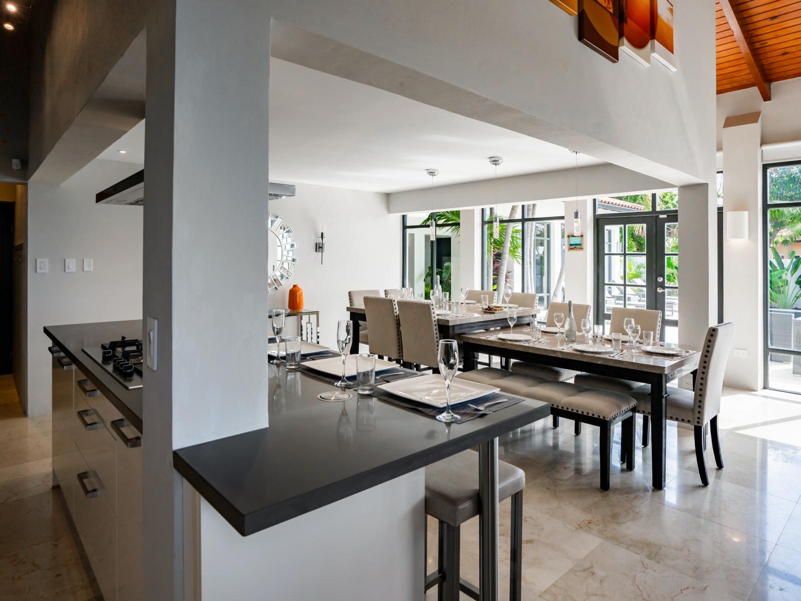 Opulent Dining Area of the Villa in Noord Aruba - 12 Persons Dining - Chic dining area featuring a stylish table and contemporary seating - Near Kitchen for easy access