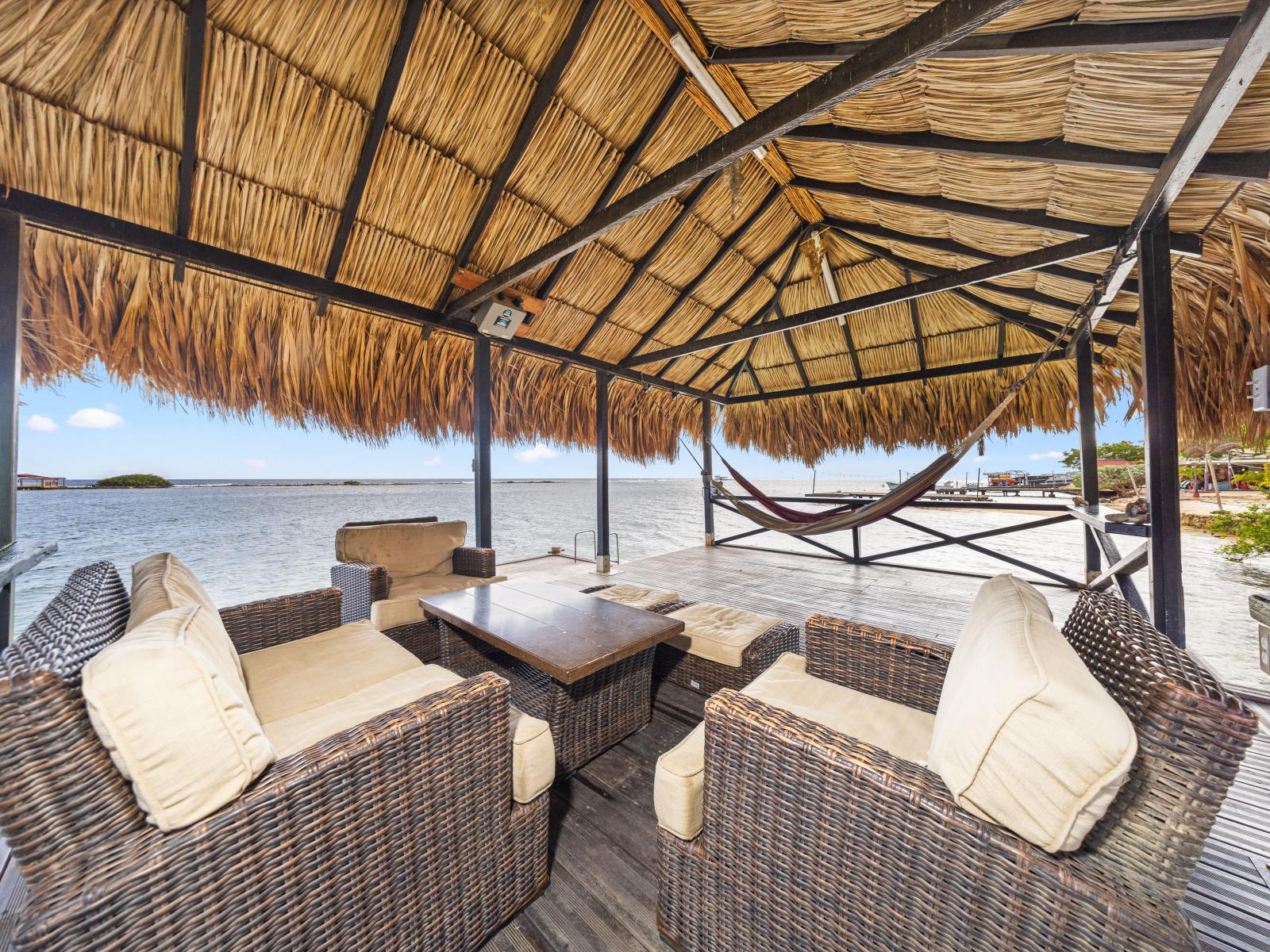 Relax in ultimate tranquility on our private pier, where a hanging hammock sways gently with the rhythm of the ocean, offering the perfect spot to unwind and immerse yourself in the soothing sounds of the sea.