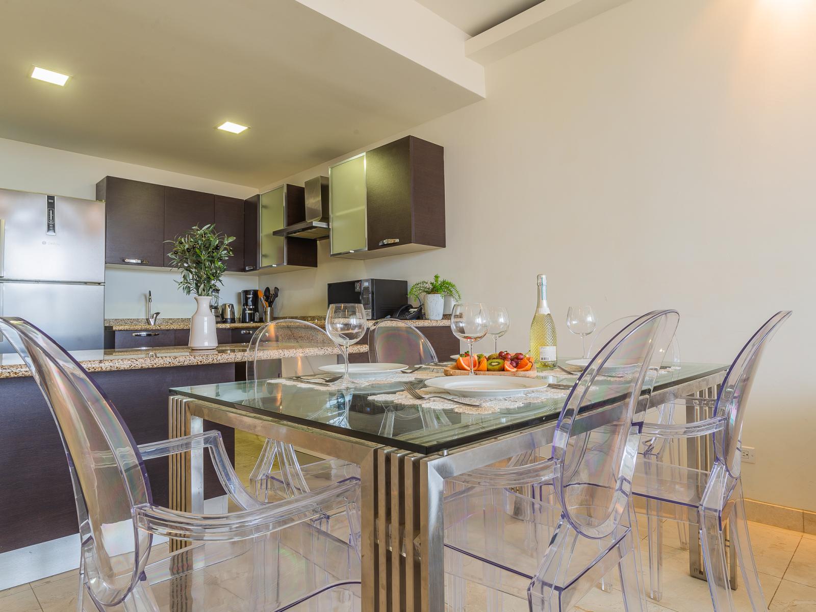 Eclat Dining Area of the lovely condo in Oranjestad Aruba - 6 Persons Dining - Functional and aesthetically pleasing storage solutions for tableware - Open layout seamlessly connecting the dining area to the kitchen and living room.