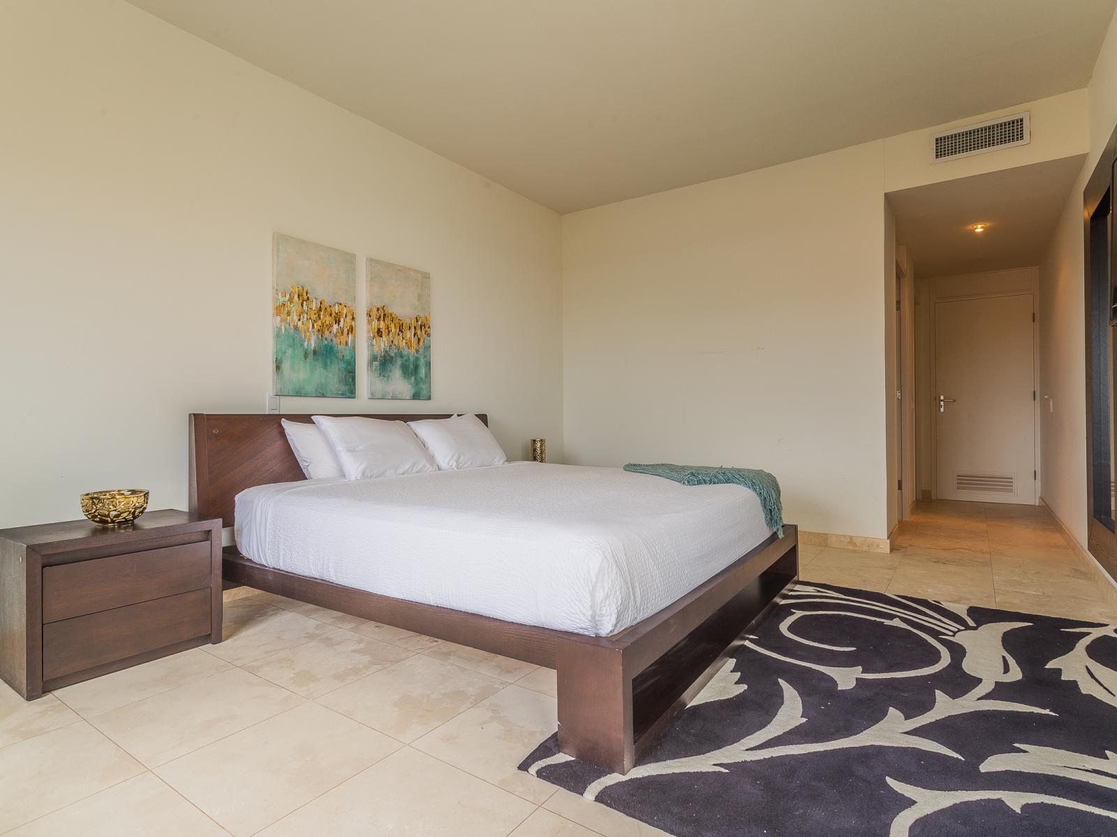 Retreat to luxury in our main bedroom, boasting a plush king bed, a sleek TV for entertainment, and a convenient attached bathroom. From restful nights to lazy mornings, every moment is elevated with comfort and convenience in mind.