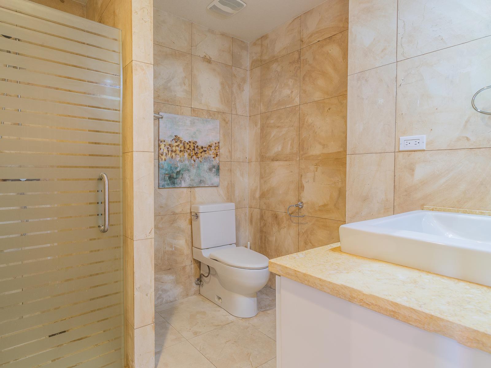 Step into luxury in Bathroom 1, seamlessly attached to the bedroom, featuring a refreshing shower. With modern fixtures and elegant design, this ensuite offers a tranquil retreat where you can unwind and refresh in style.