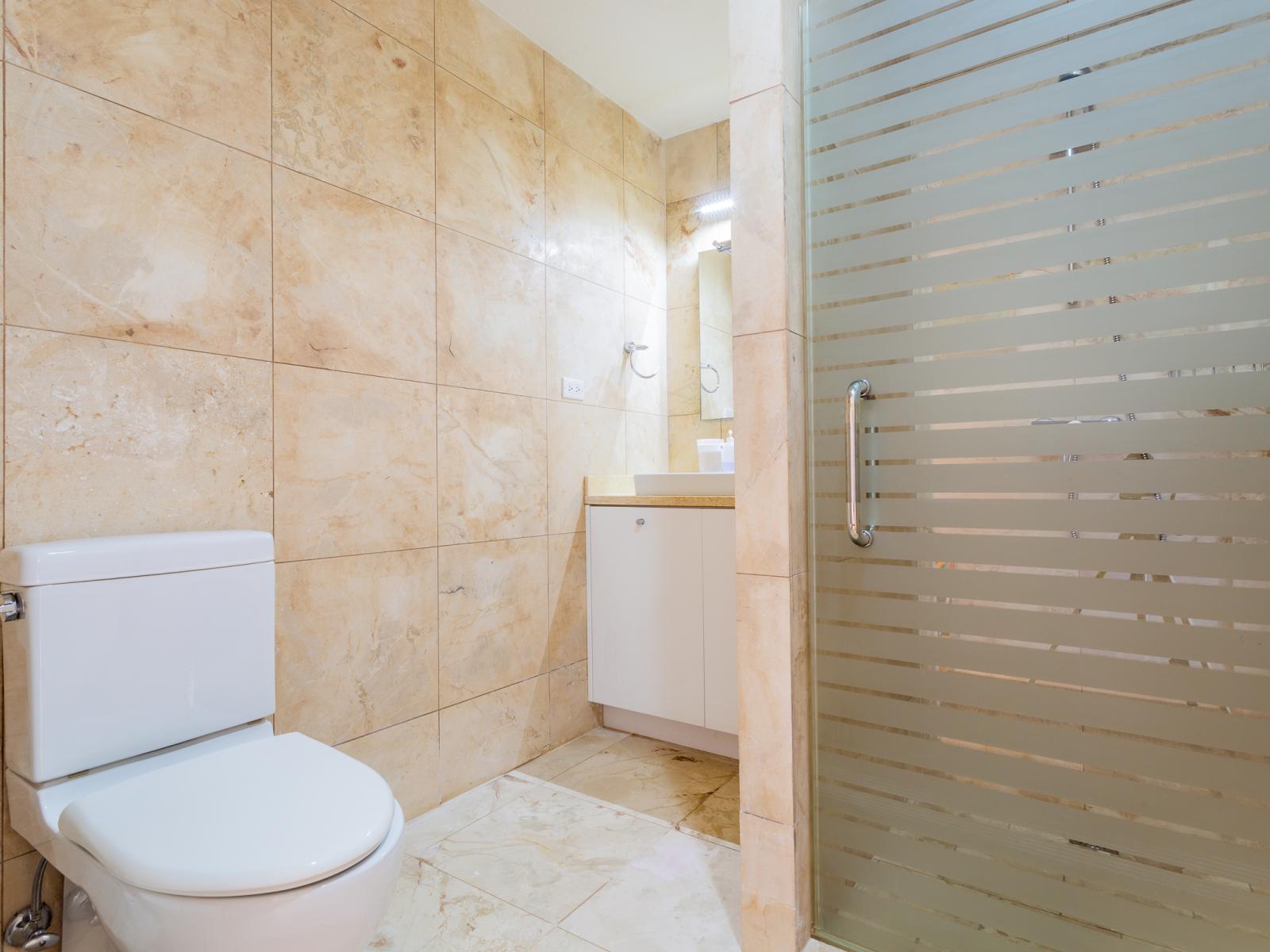 Discover convenience and comfort in Bathroom 2, featuring a rejuvenating shower for your daily refreshment. With modern amenities and stylish design, this well-appointed space ensures a seamless and invigorating experience.