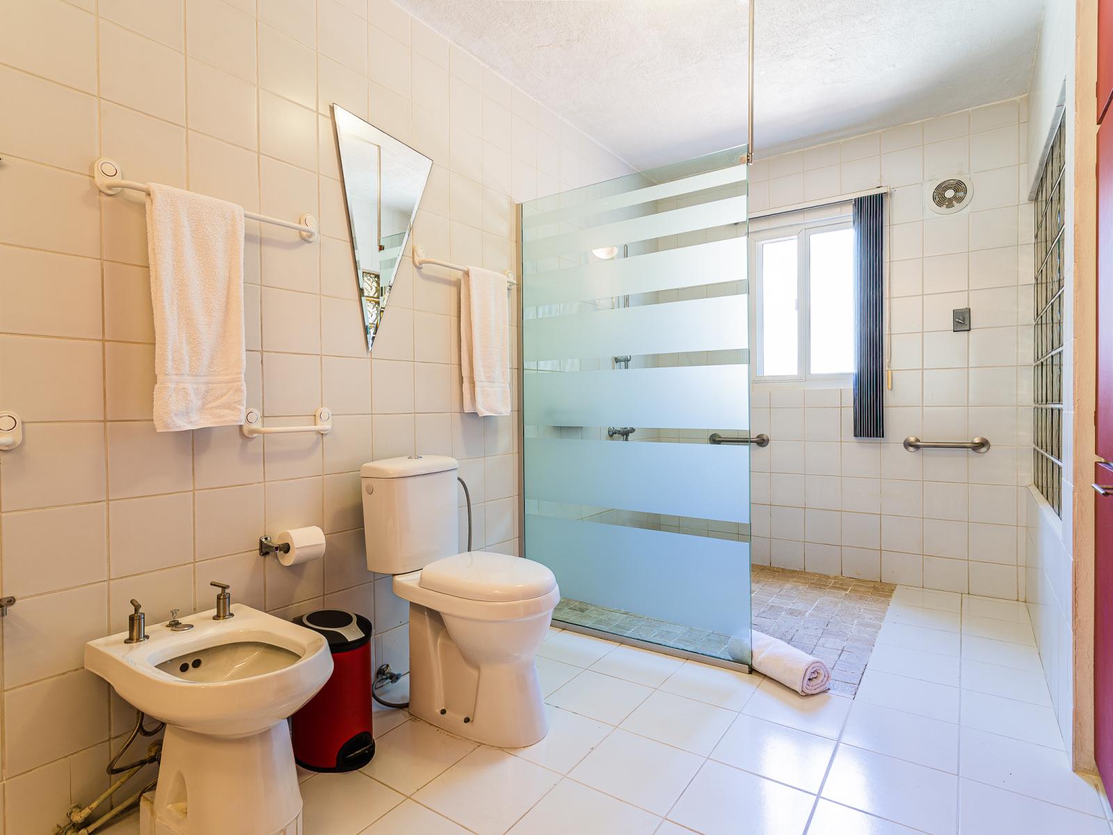 Experience the elegance of Bathroom 2, complete with a spacious walk-in shower for your ultimate relaxation and comfort.