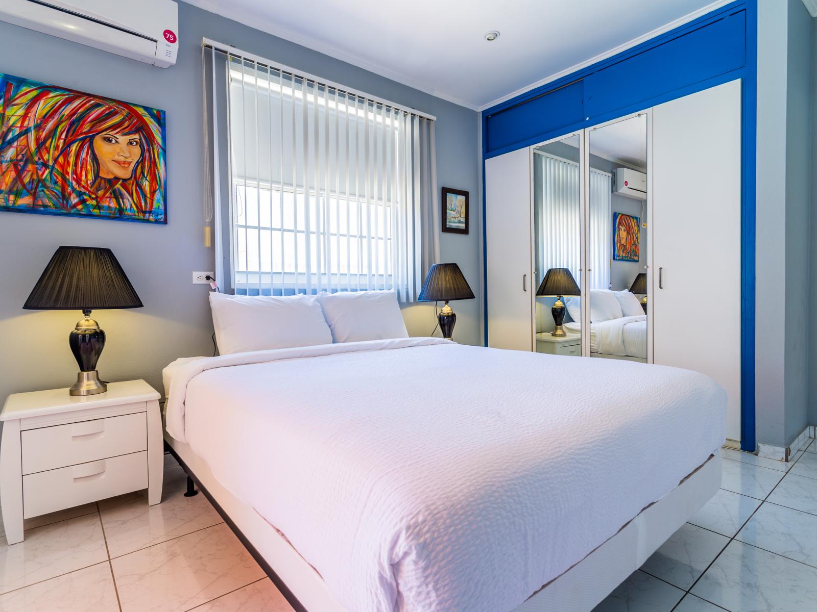 Relax in Bedroom 2, featuring a cozy queen-size bed, perfect for a restful night's sleep and ultimate comfort.