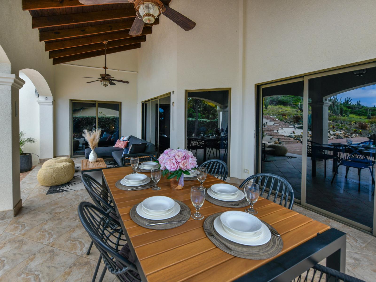 Outdoor dining area with ceiling fan to keep you cool on sunny days