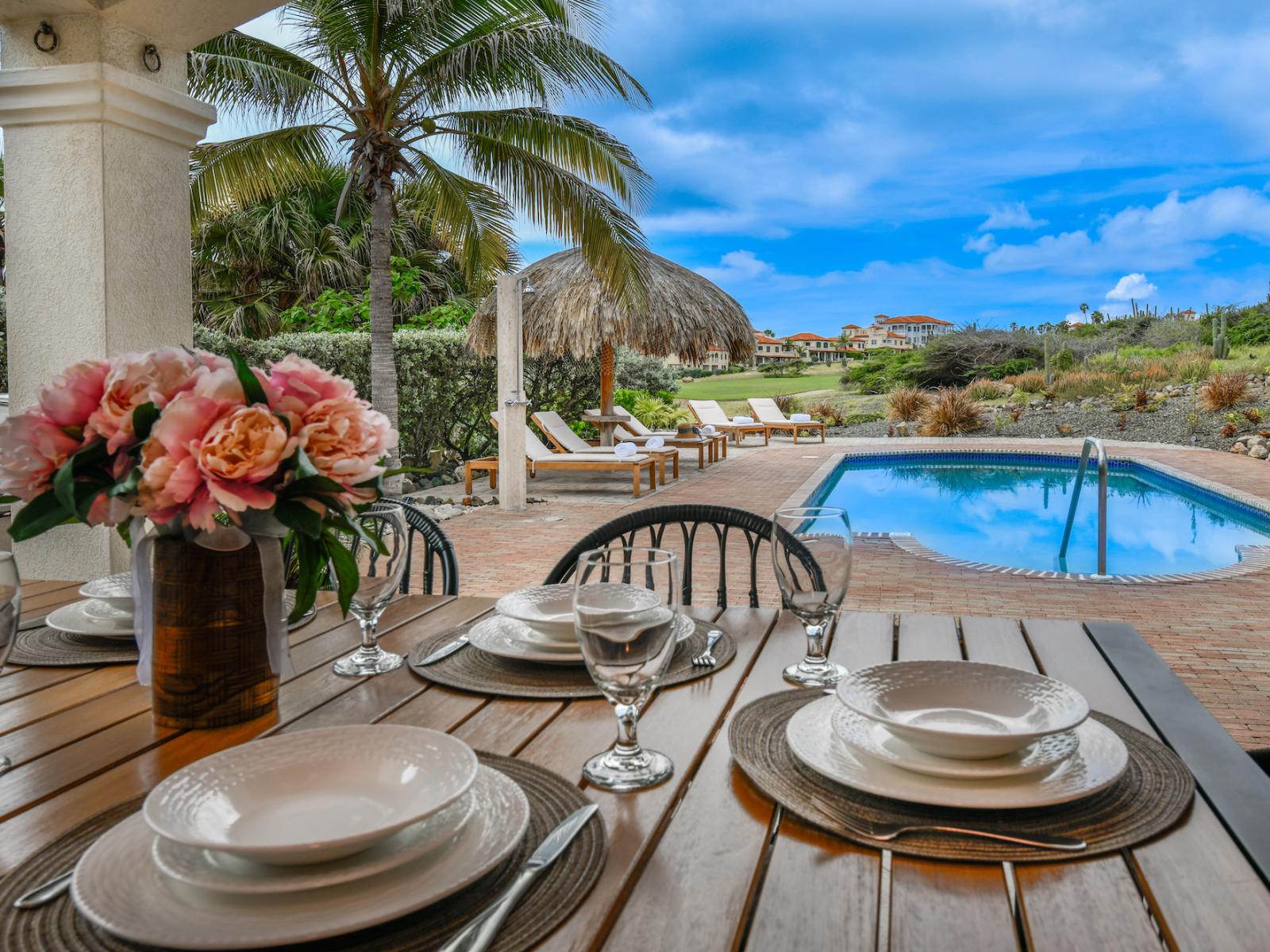 Dine in style surrounded by nature's beauty: our al fresco dining area sets the scene for unforgettable evenings.