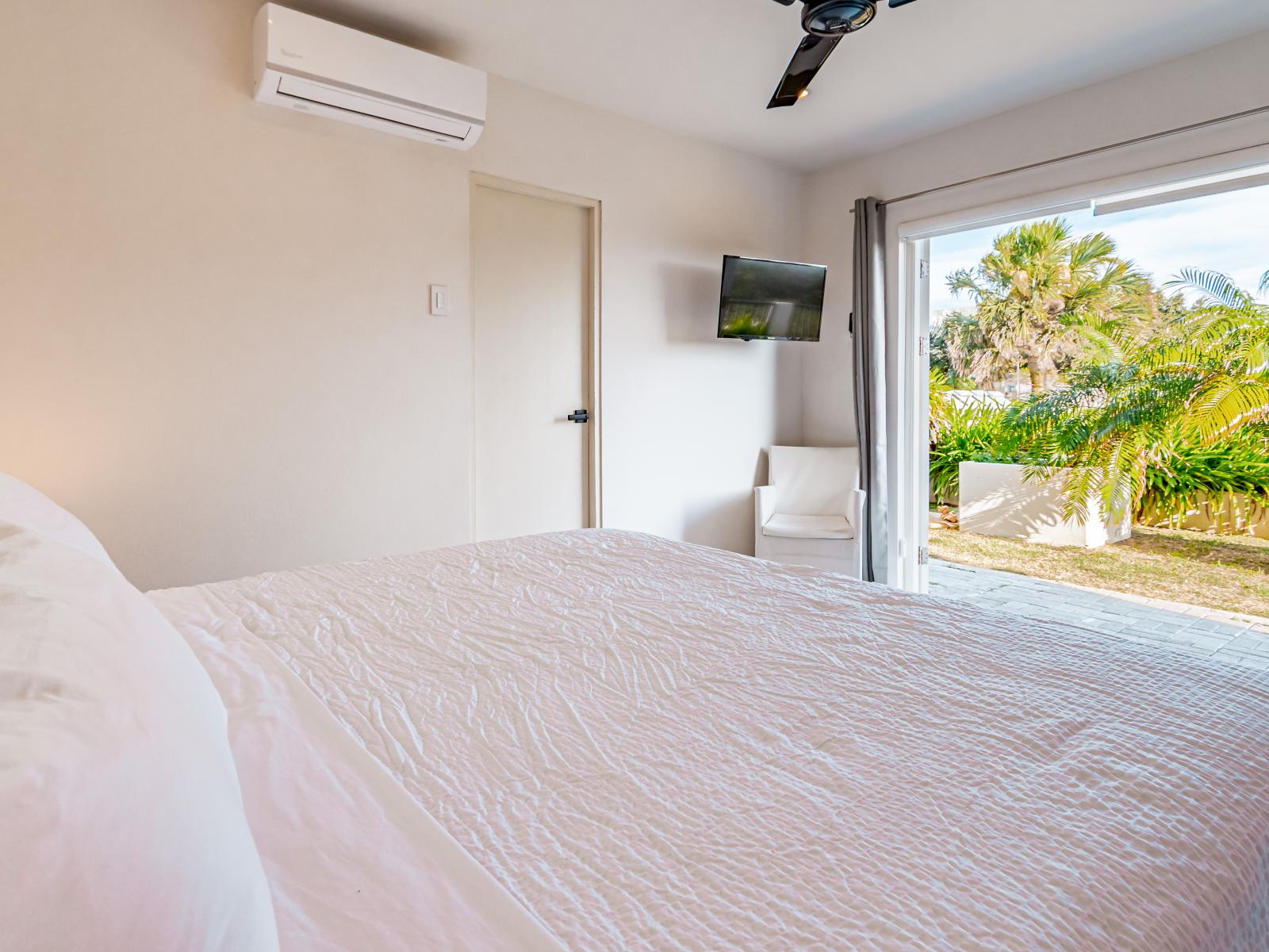 Comfy Bedroom of the Home in Santa Cruz Aruba - Plush Double size bed - Attached bathroom comfort and convenience - Thoughtfully Designed space - Smart TV and Netflix - Stunning outside views