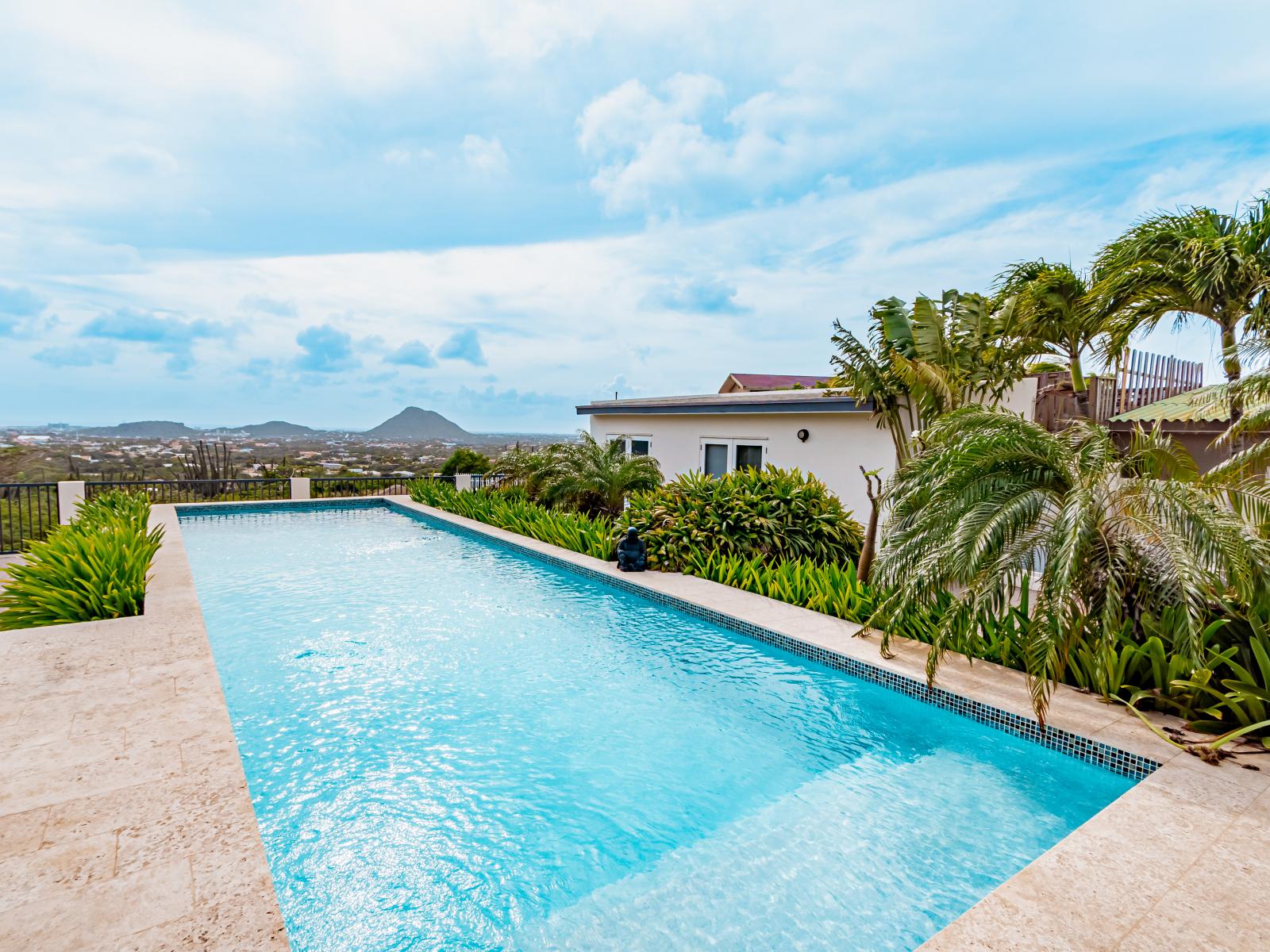 Splendid Pool Area of the Home in Santa Cruz Aruba - Show stopping pool with a picturesque view - Immerse yourself in the cool elegance of pool - Experience ultimate relaxation in poolside paradise - Breathtaking views