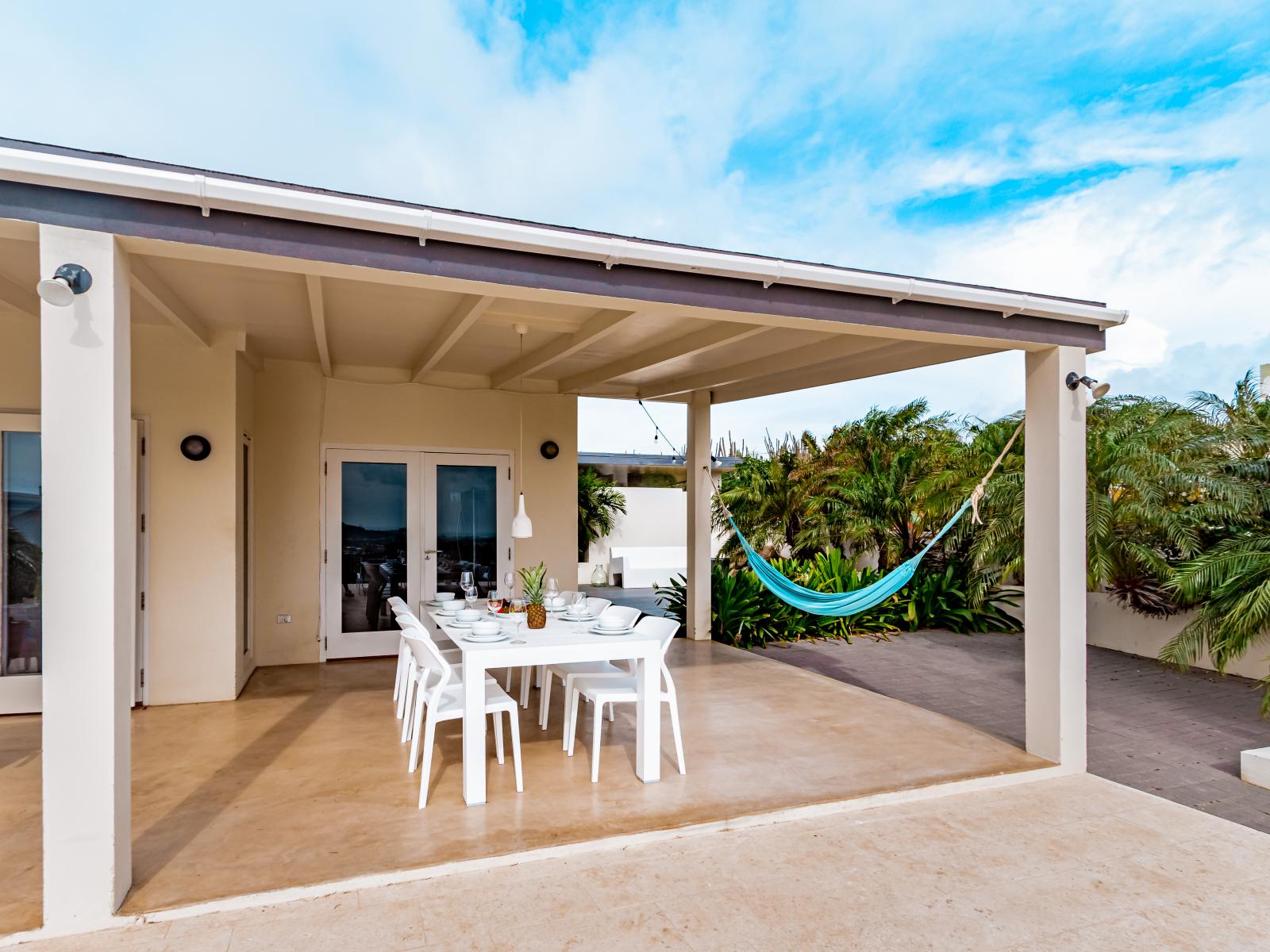 Elegant Outdoor Dining Area of the Home in Santa Cruz Aruba - Savor the flavors of paradise - Outdoor dining experience offers a feast for the senses - Every meal accompanied by stunning views