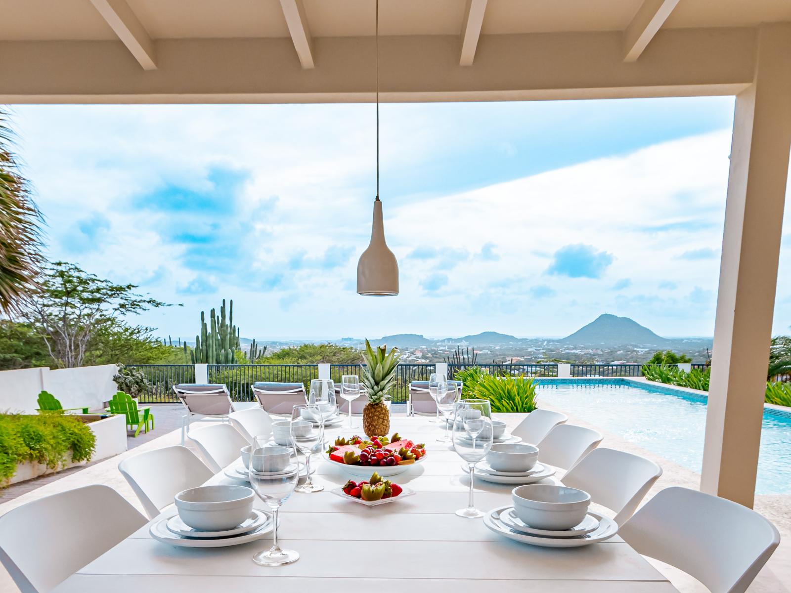 Lush Outside Dining Area of the Home in Santa Cruz Aruba - Dine al fresco, where every meal becomes a breath of fresh air - Unwind in our outdoor haven, where every meal is a breeze - Pool Views - Dining table fit for any occasion