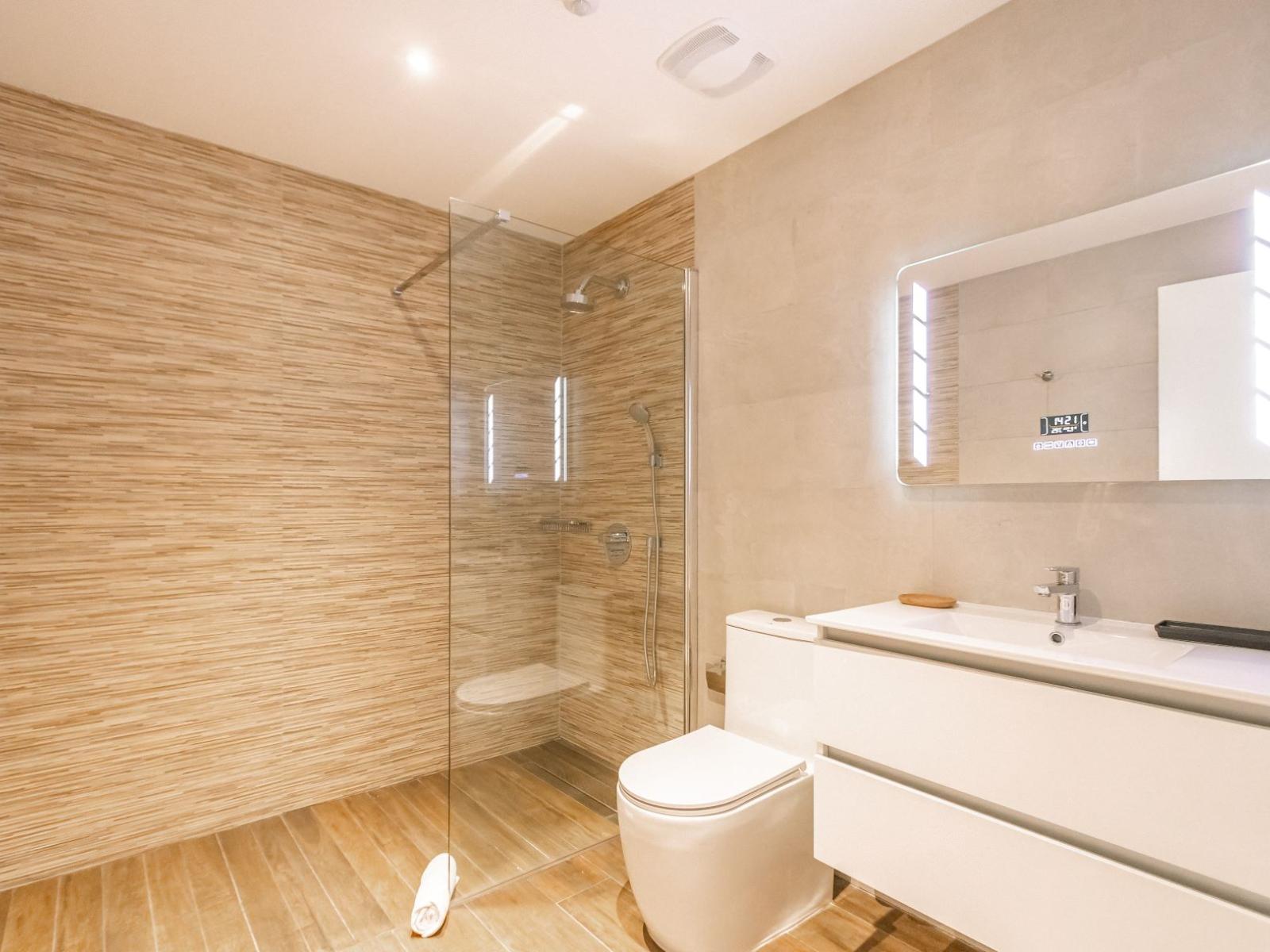 Bathroom 6 features a modern walk in shower