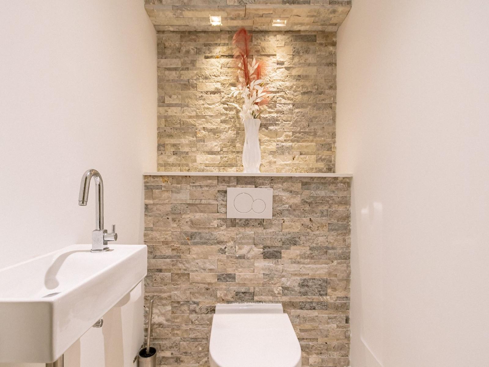 Bathroom 6 features a modern vanity and toilet