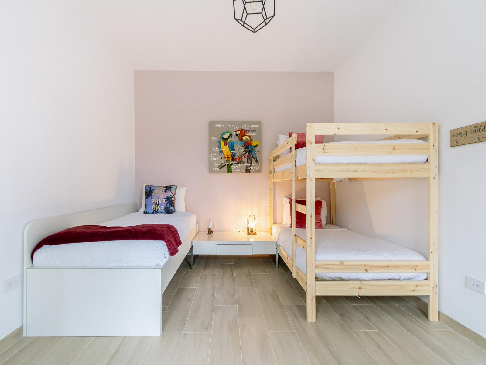 Bedroom 7 offers a fun bunk bed and twin bed