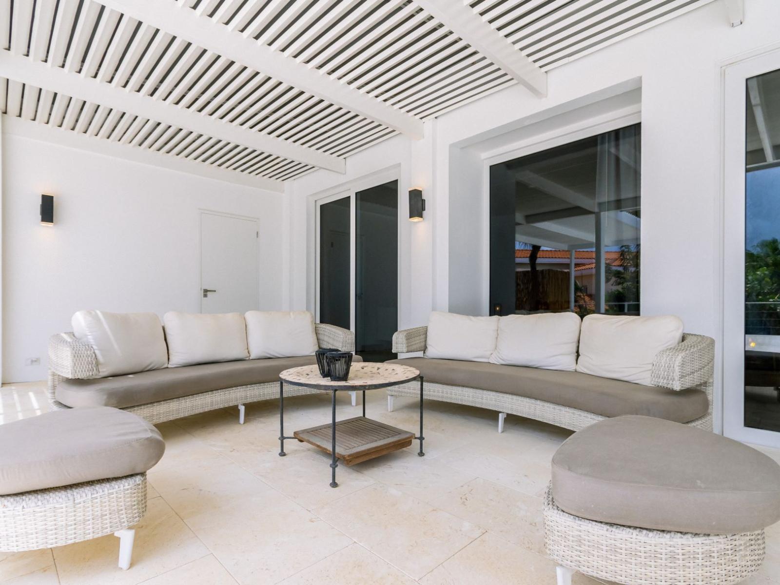 Cozy outdoor lounge area by the pool