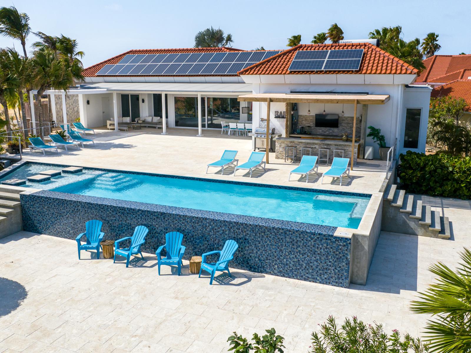 Refreshing pool with lots of lounge chairs