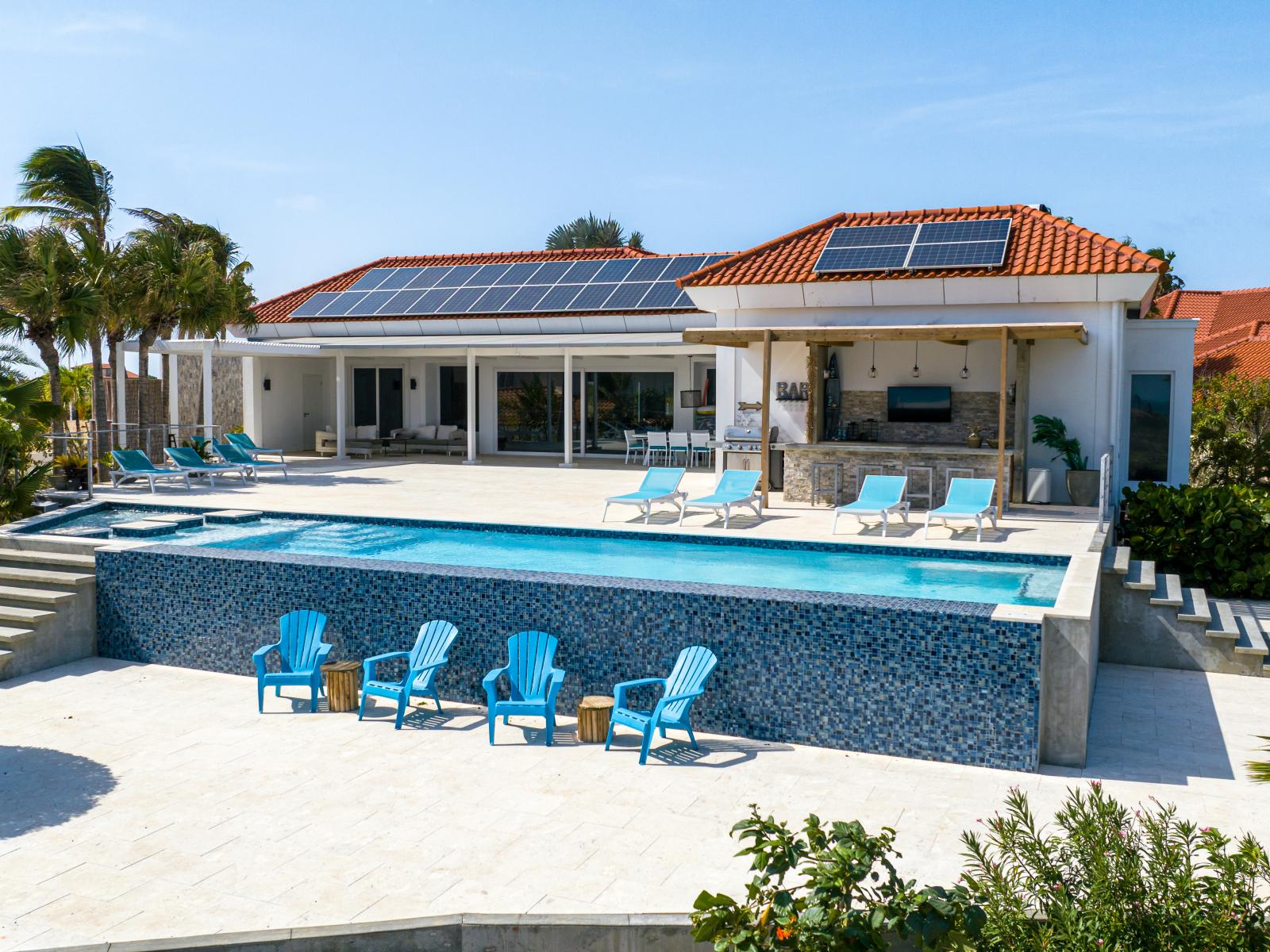 Refreshing pool with lots of lounge chairs