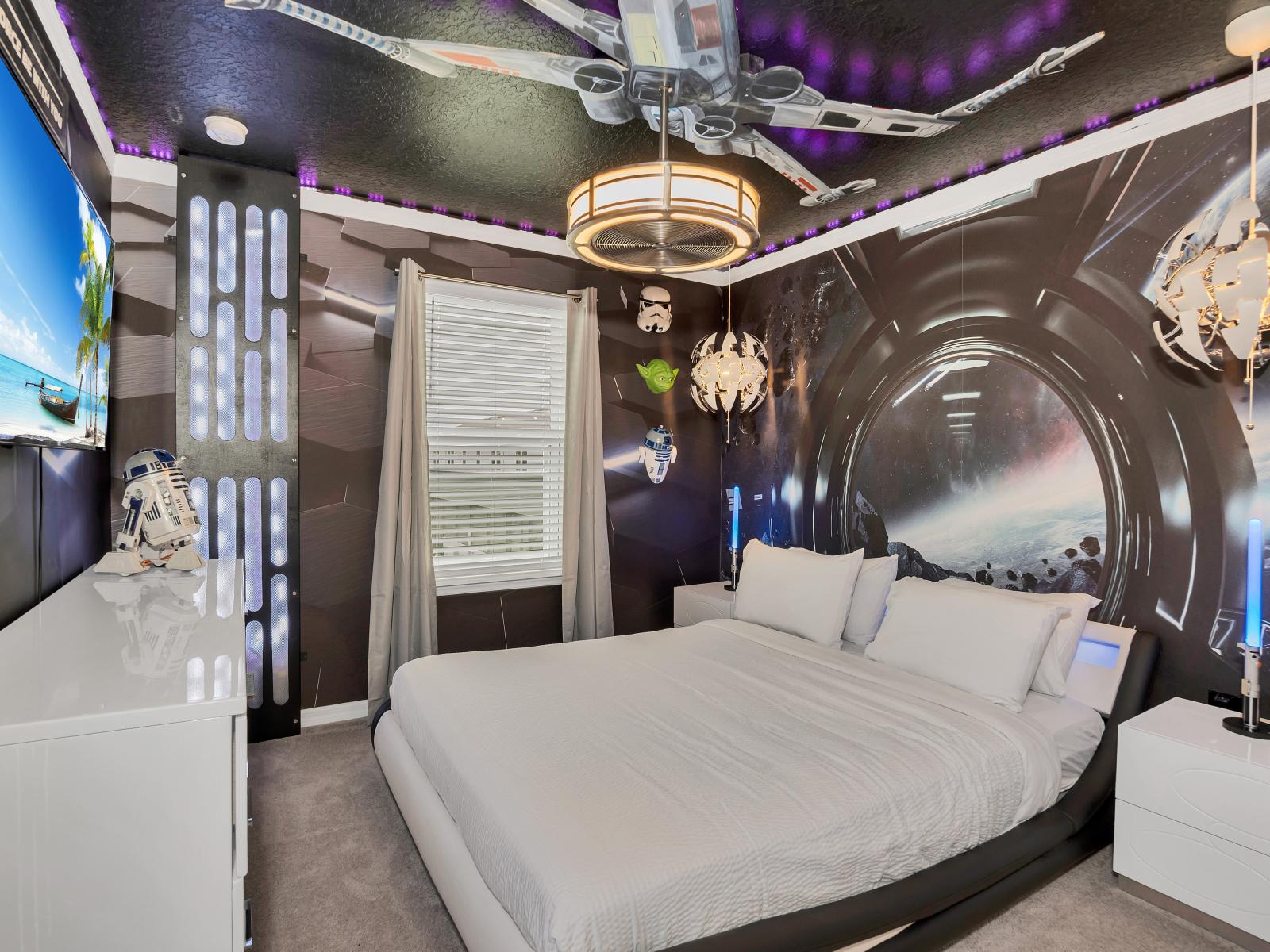 Journey to the Stars: Step into the Galactic-themed bedroom inspired by Star Wars, where adventure awaits in every corner. With iconic motifs and immersive decor, it's a celestial sanctuary where dreams of distant galaxies and epic battles ignite.