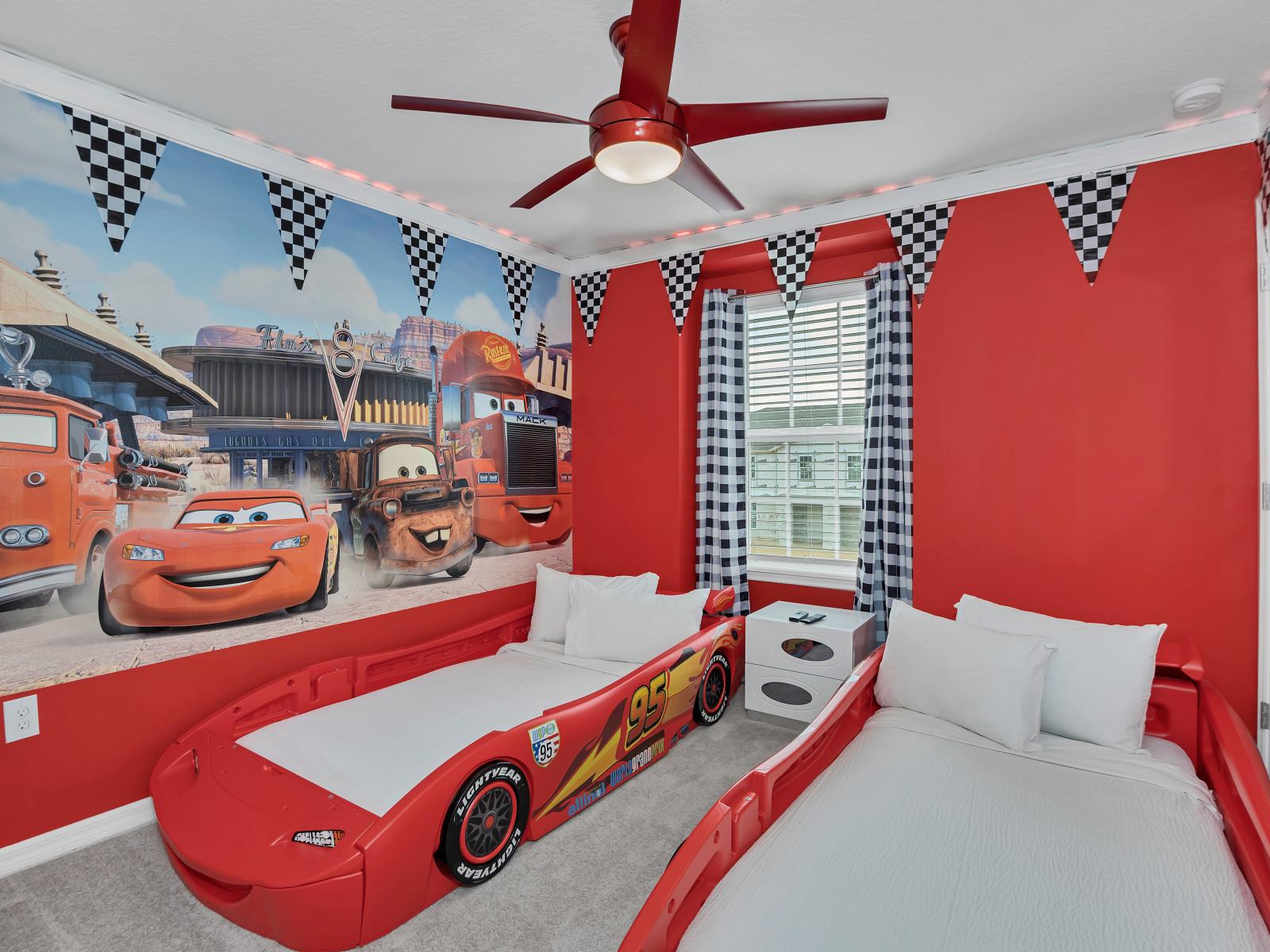 Step into the Cars-themed bedroom, where the excitement of the race track comes to life. With two car-designed beds and vibrant motifs, it's a thrilling retreat where every night is a high-speed adventure.