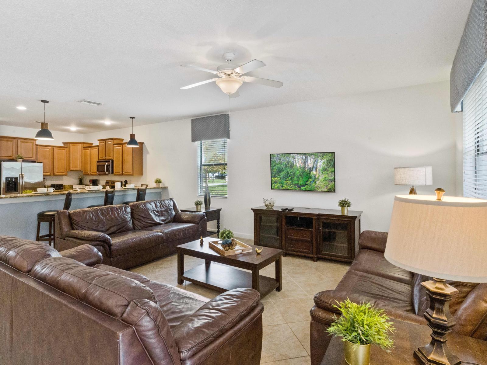 The living room is thoughtfully decorated, and there you will find 3 sofas where each one of your group can sit back and enjoy watching a TV show.