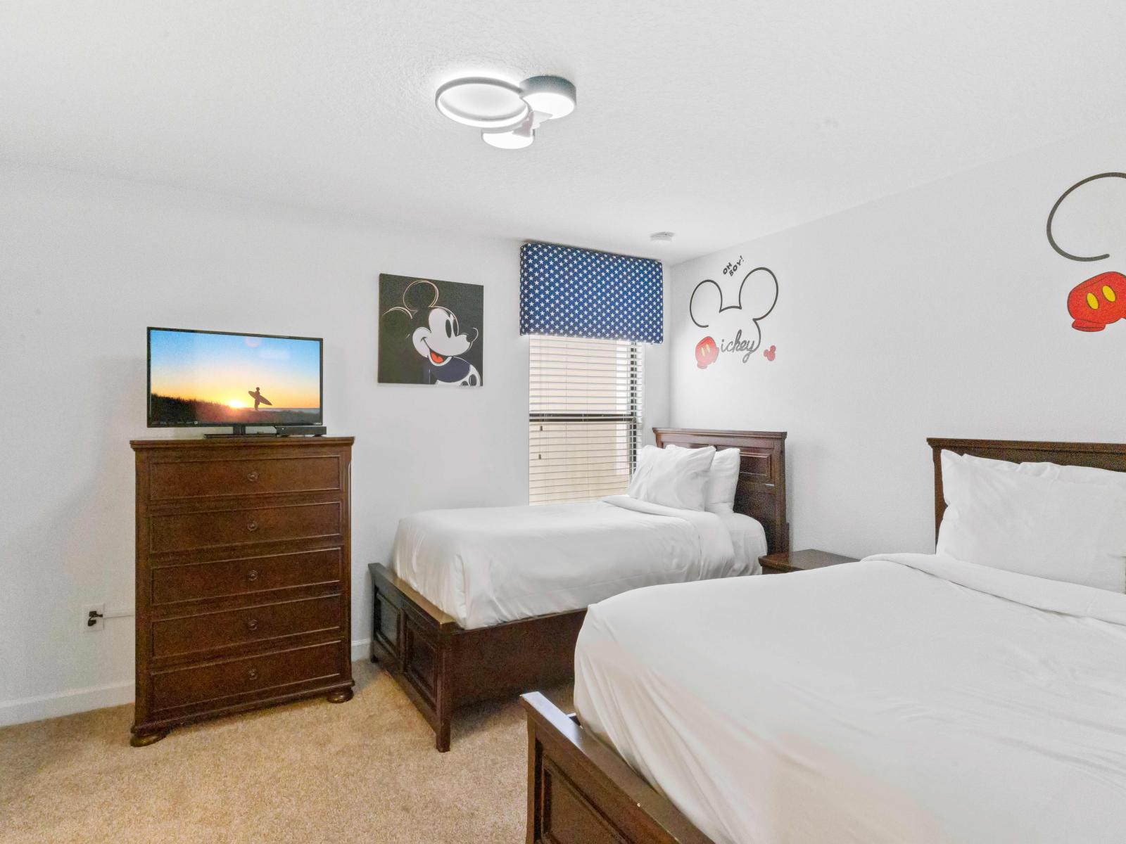 This Mickey themed room comes with a full size bed, a twin size bed, a large tall dresser, and endless hours of fun!